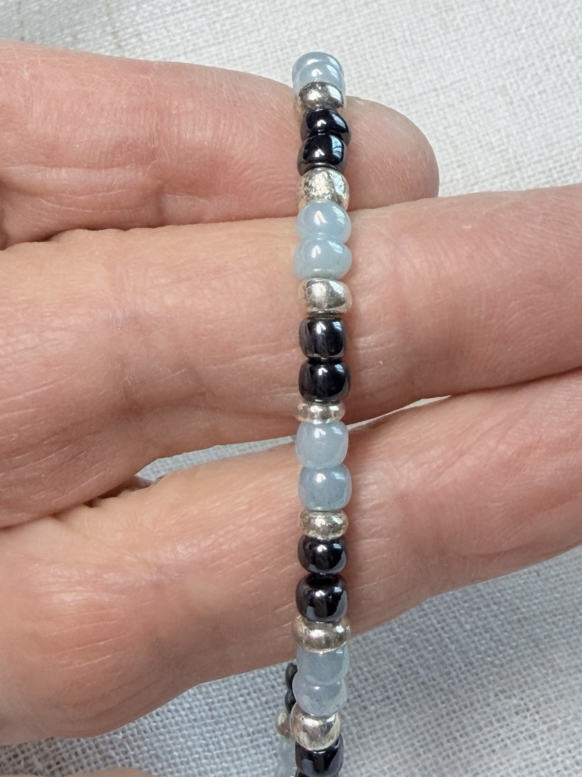 Boho bracelet set,light blue,silver,brown seed beads. Stretchy- 7.25” to 7.75”.