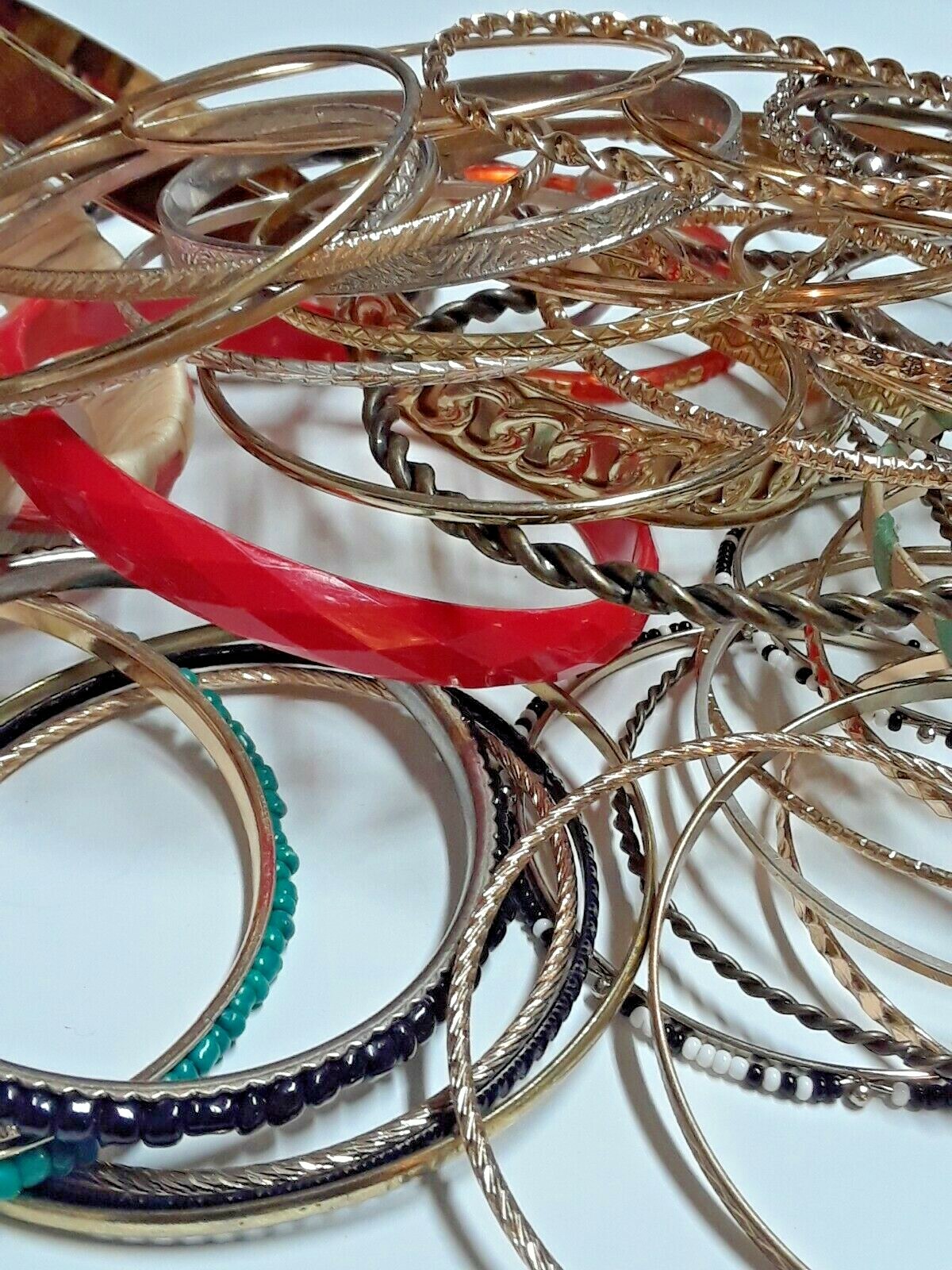 Bangle bracelets. gold tone silver tone, metal, plastic, with patterns. Lot
