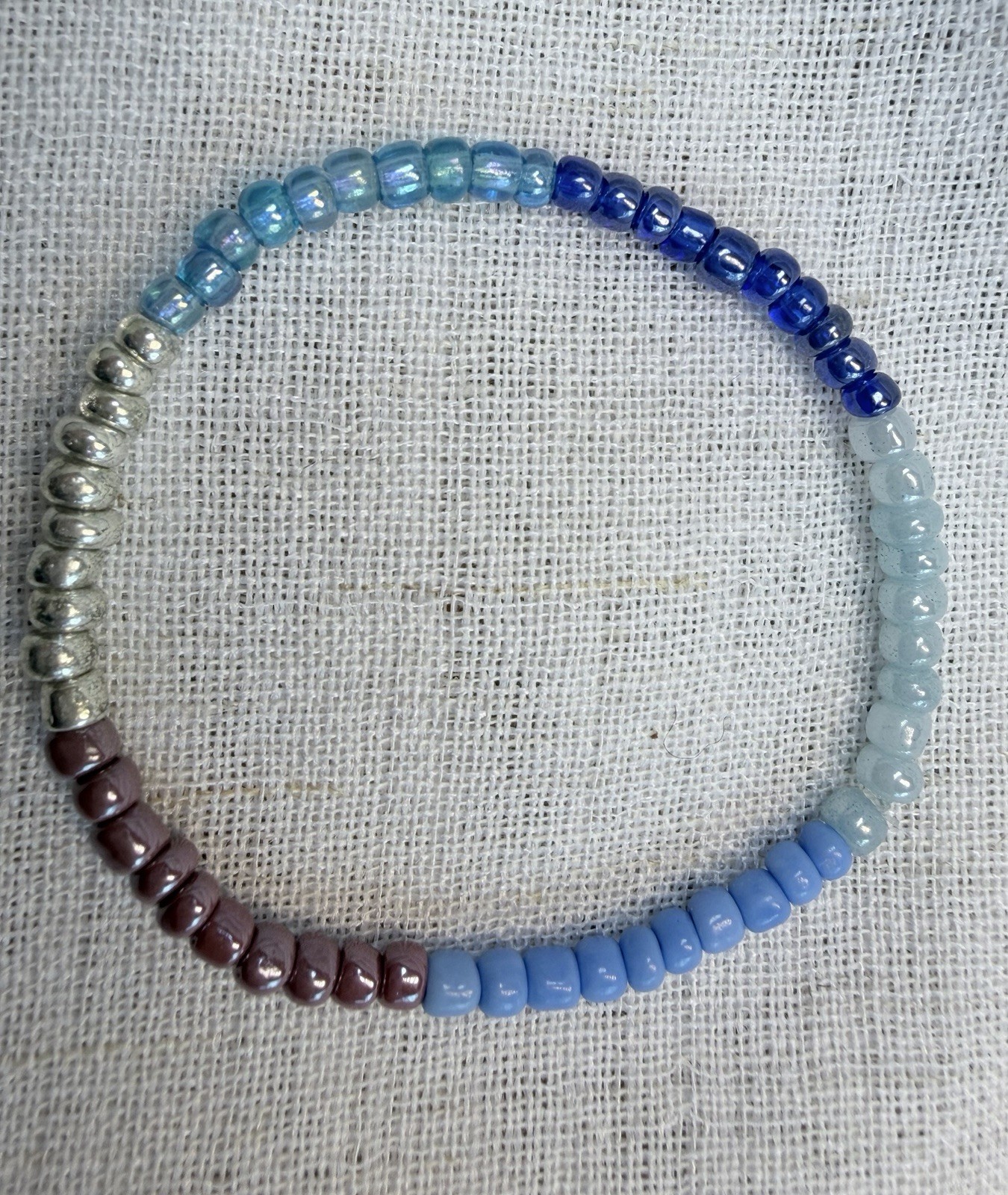 Boho bracelet set,light blue,silver,brown seed beads. Stretchy- 7.25” to 7.75”.