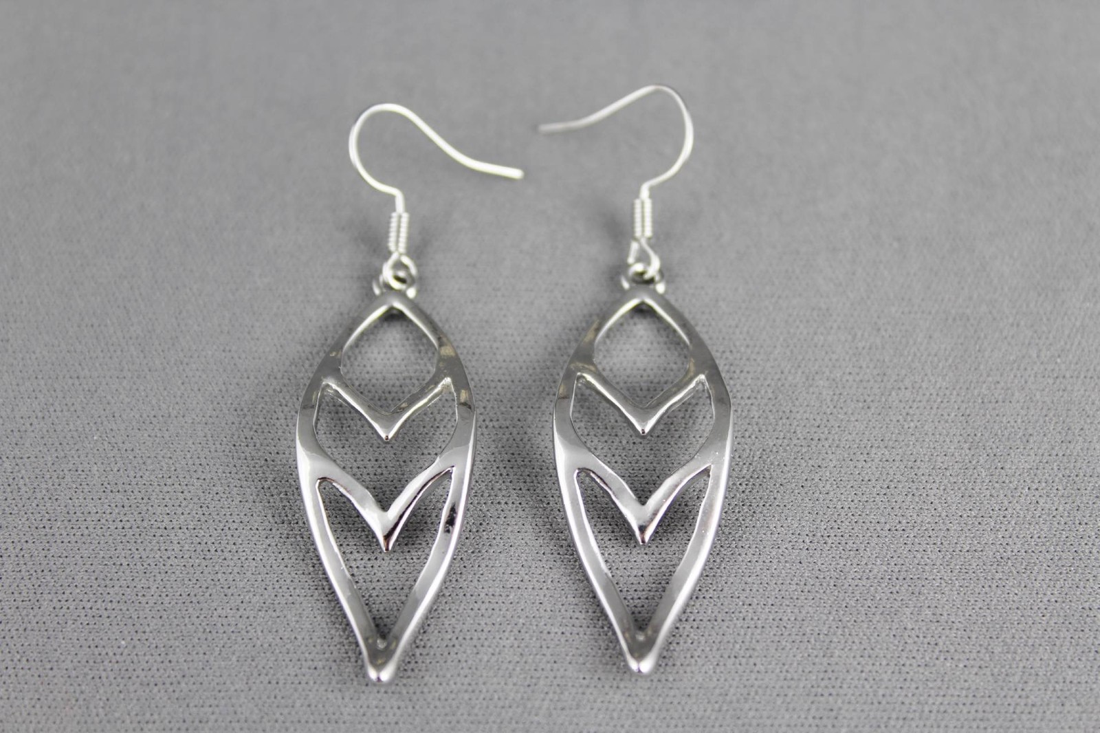silver teardrop dangle earrings chevron V pattern 2.25 inches long liteweight