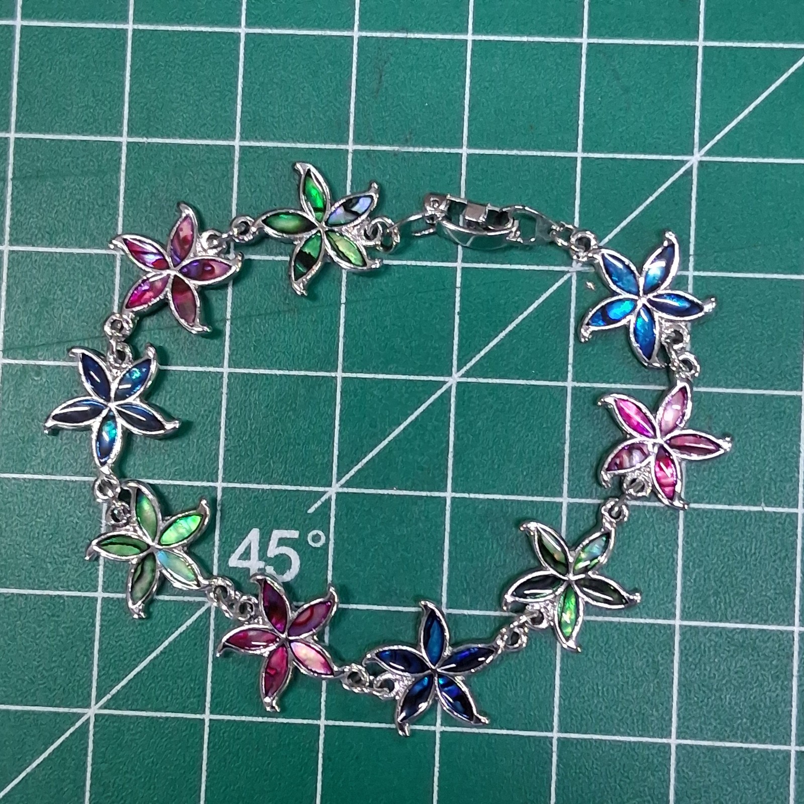 Shimmering Multicolor Linked Starfish Design Fold Over Clasp Chain Bracelet