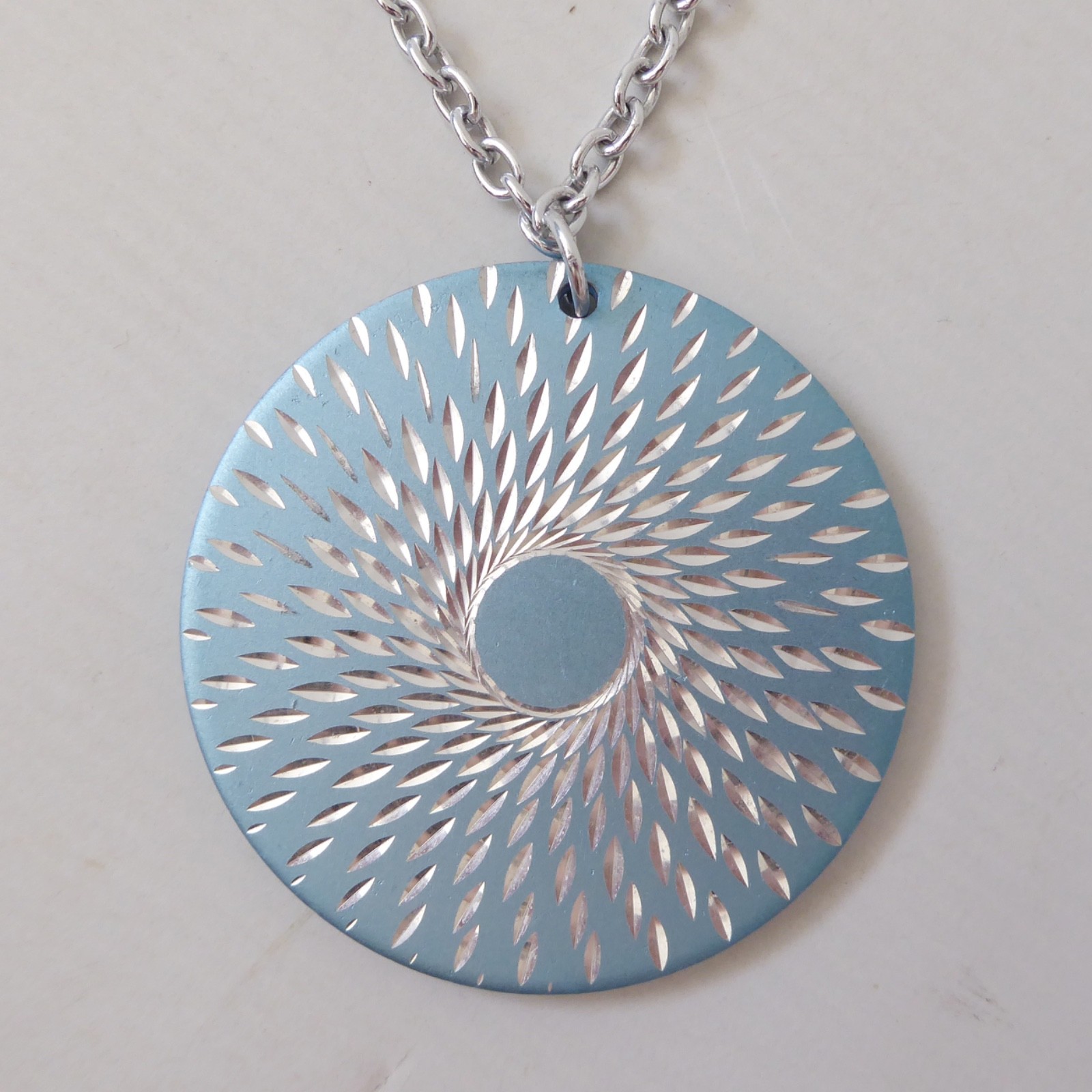Conrah cristillium pendant necklace. Aluminium anodised blue metal. Geometric
