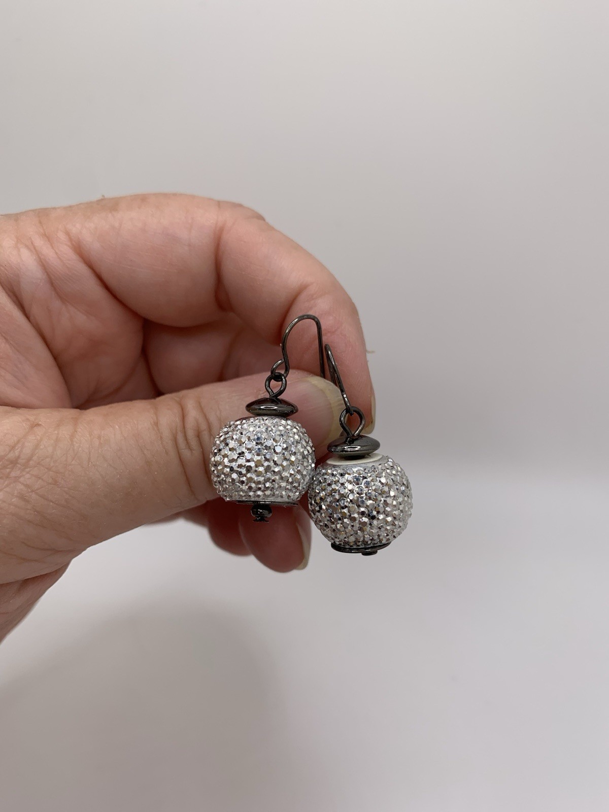 Dangle fishhook earring with pave covered sparkly spherical bead