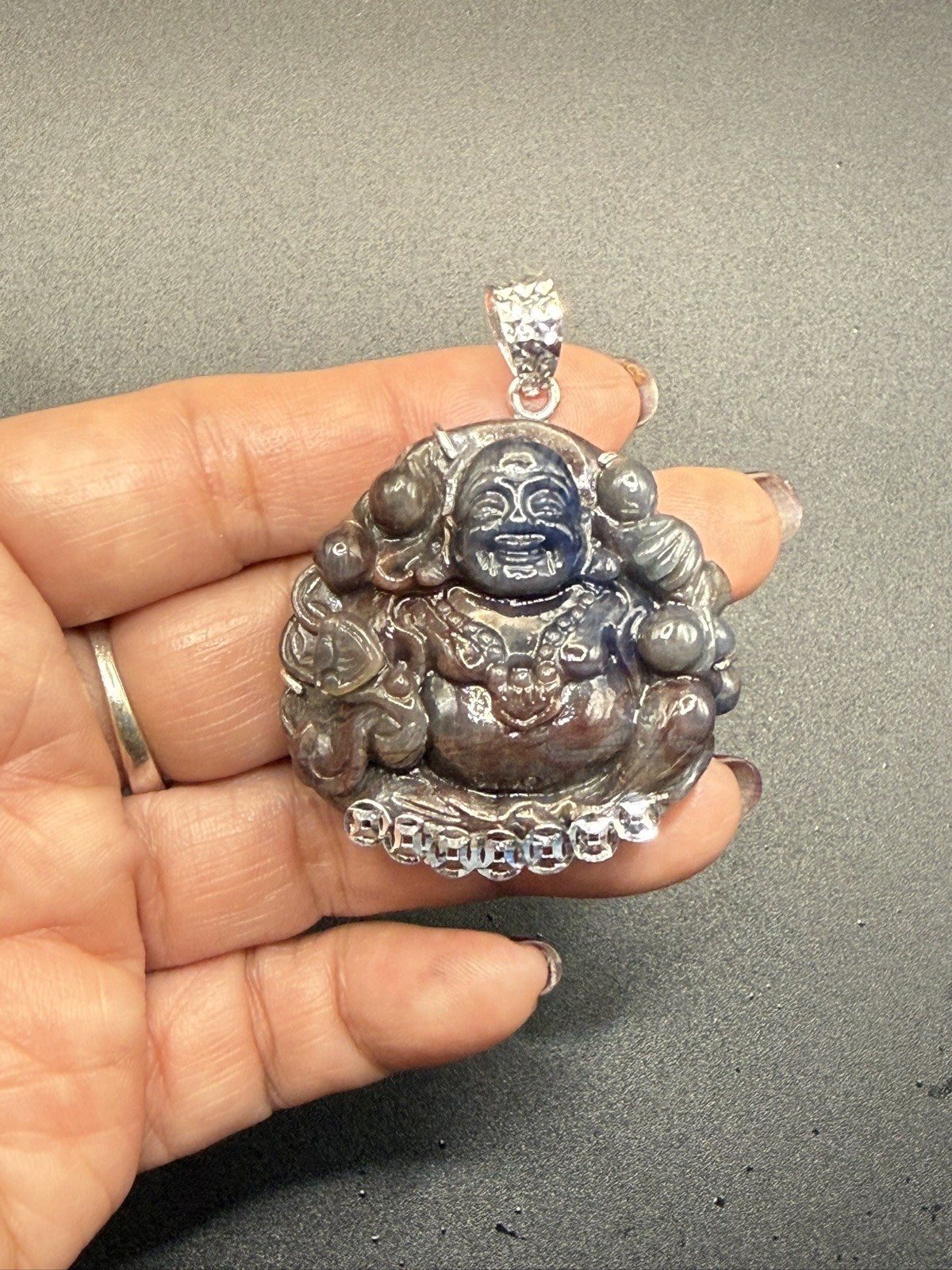 Maitreya Laughing Buddha100% Natural Saphia carved by hand. With Silver
