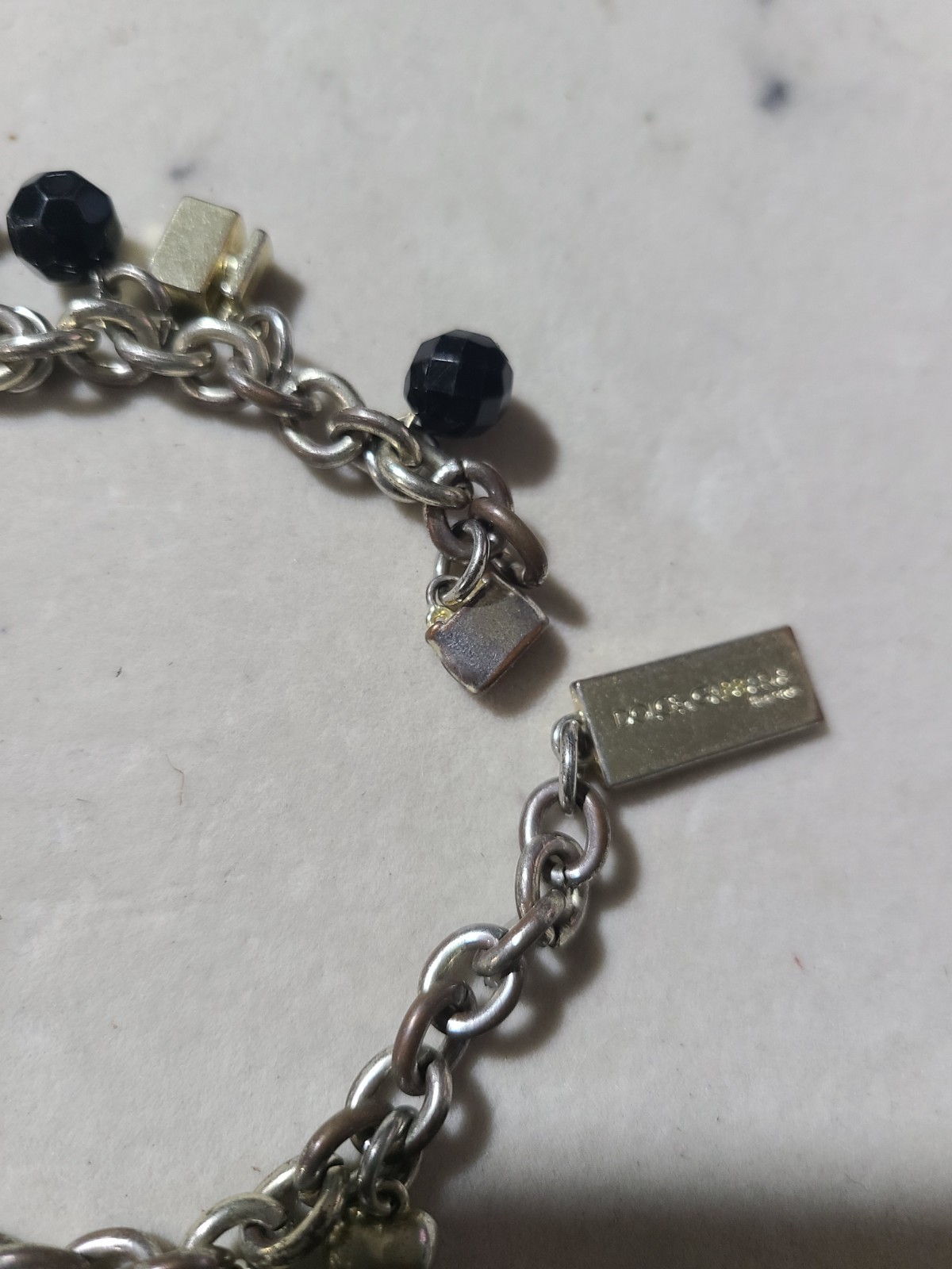 DOLCE AND GABBANA CHARMS BRACELET GOLD TONE DESIRE NEEÐ BRACELET CLASP REPAIR