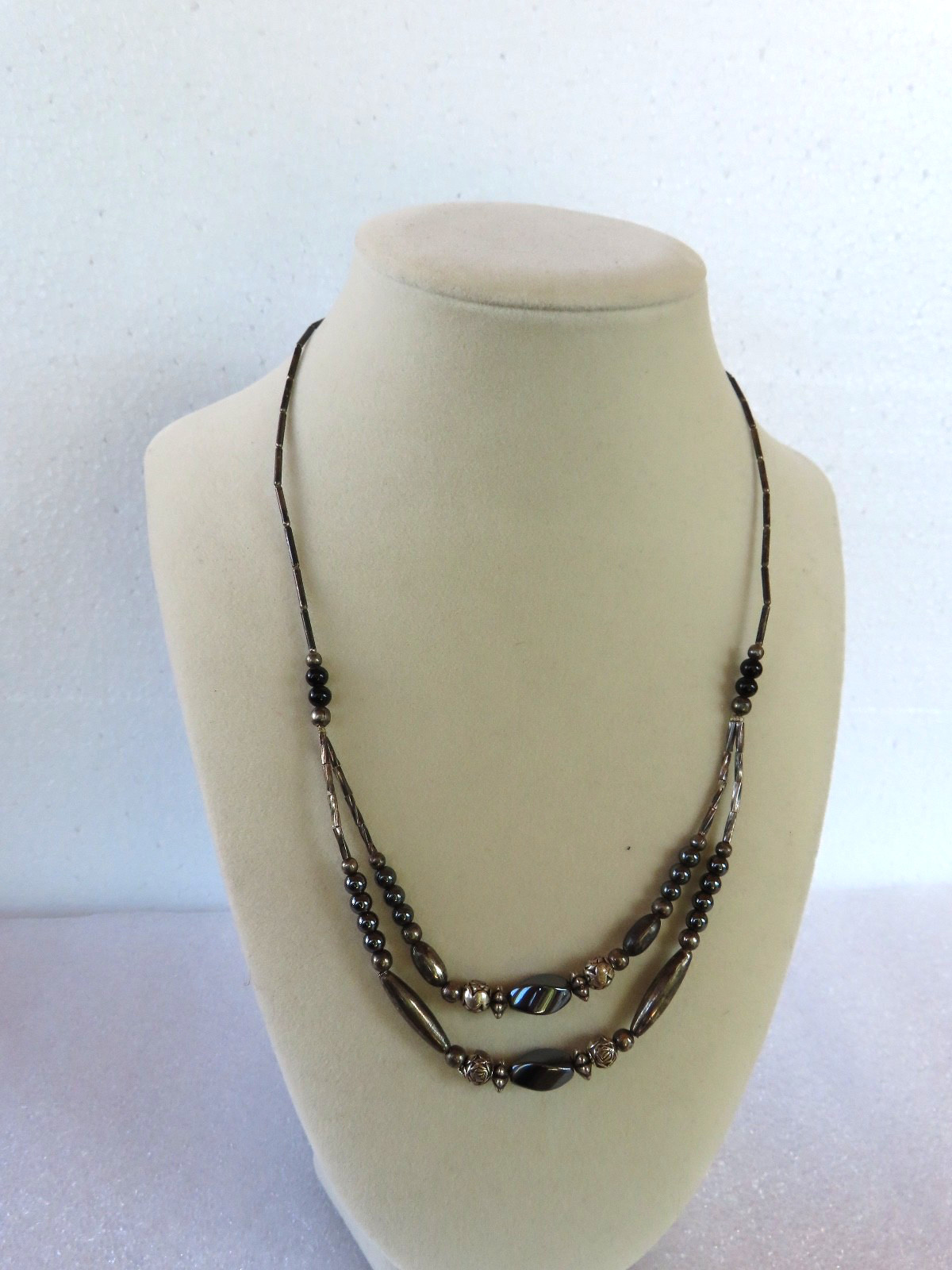 Black Beaded necklace, measures 18″ about.