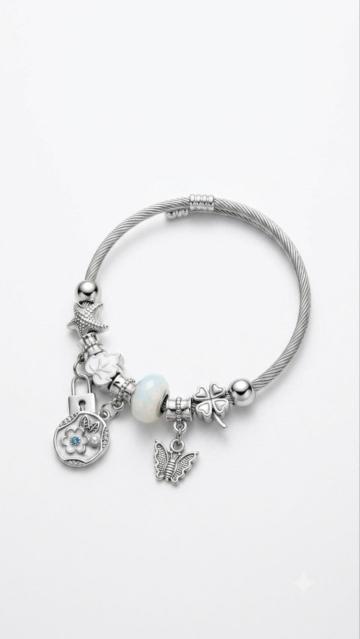 Beautiful silver-tone charm bangle bracelet featuring unique pendants and a gem