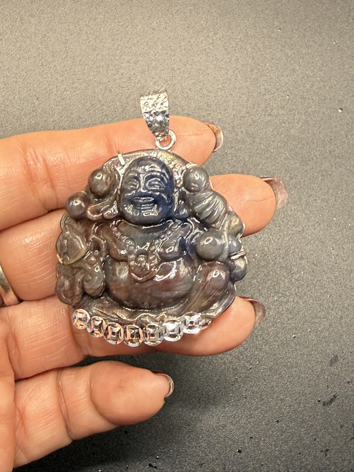 Maitreya Laughing Buddha100% Natural Saphia carved by hand. With Silver