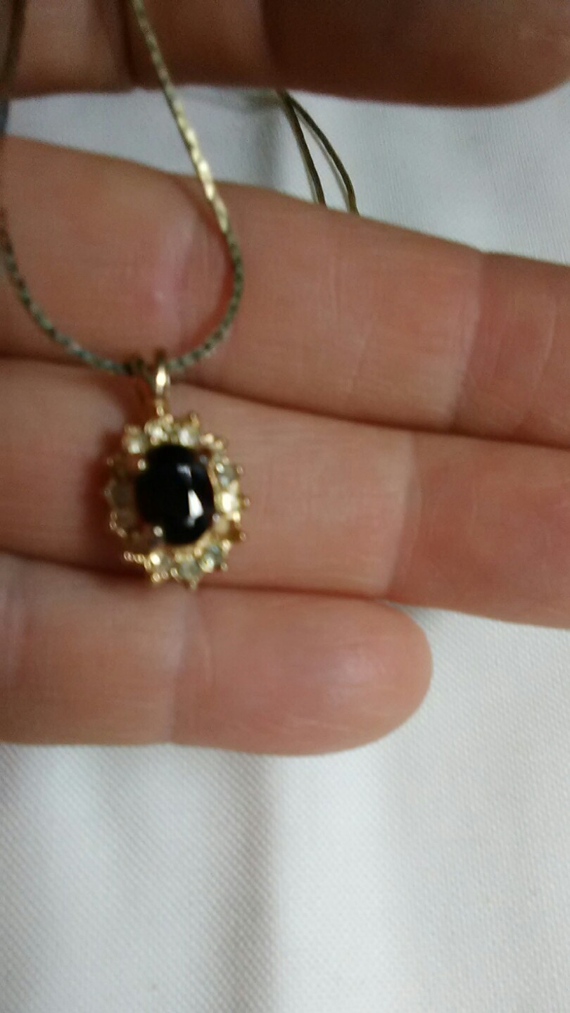 Garnet surrounded by cubic zerconia pendant January birthstone