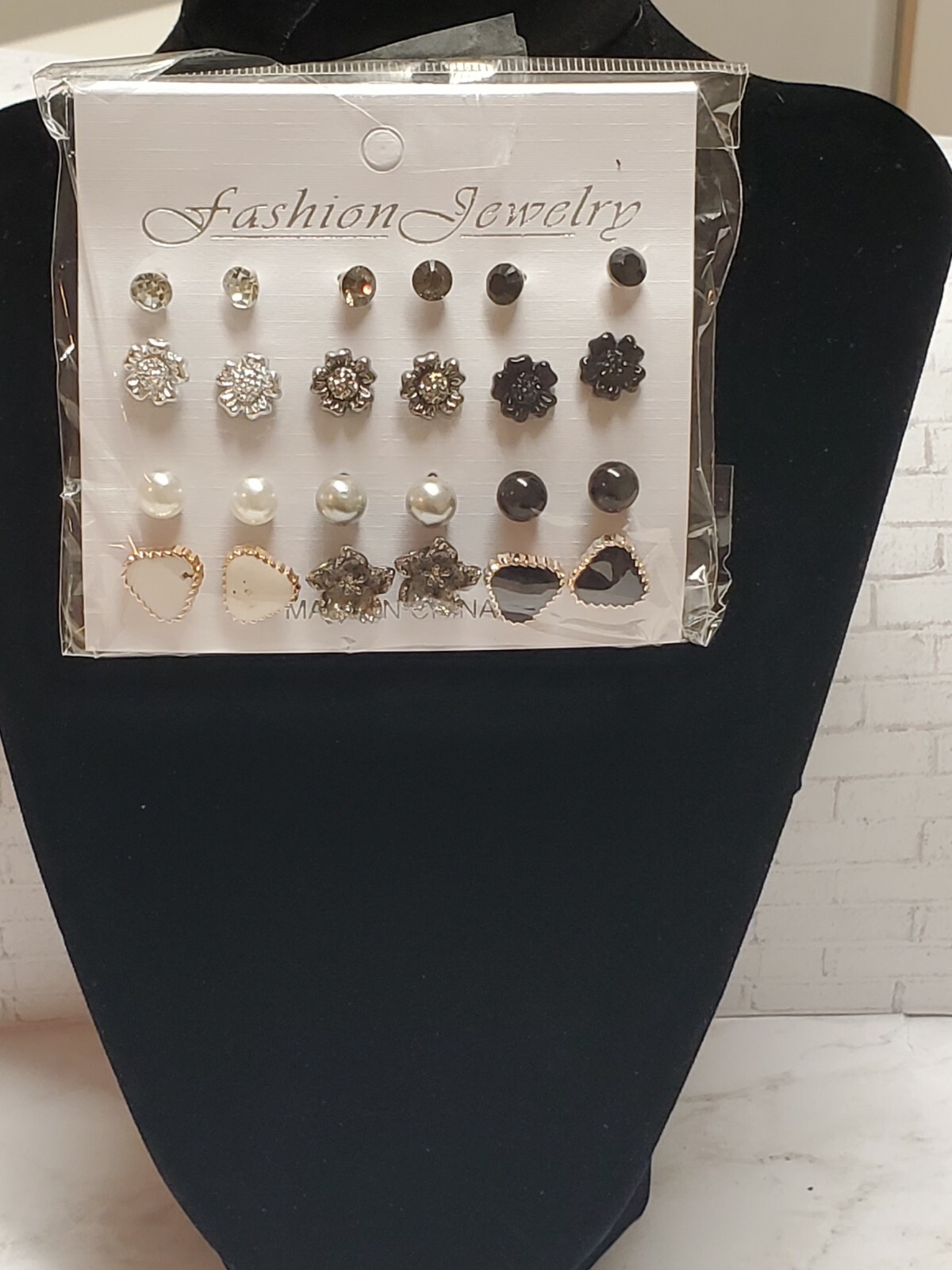 12 pair of assorted pierced metal earrings. Perfect for dressing up or down