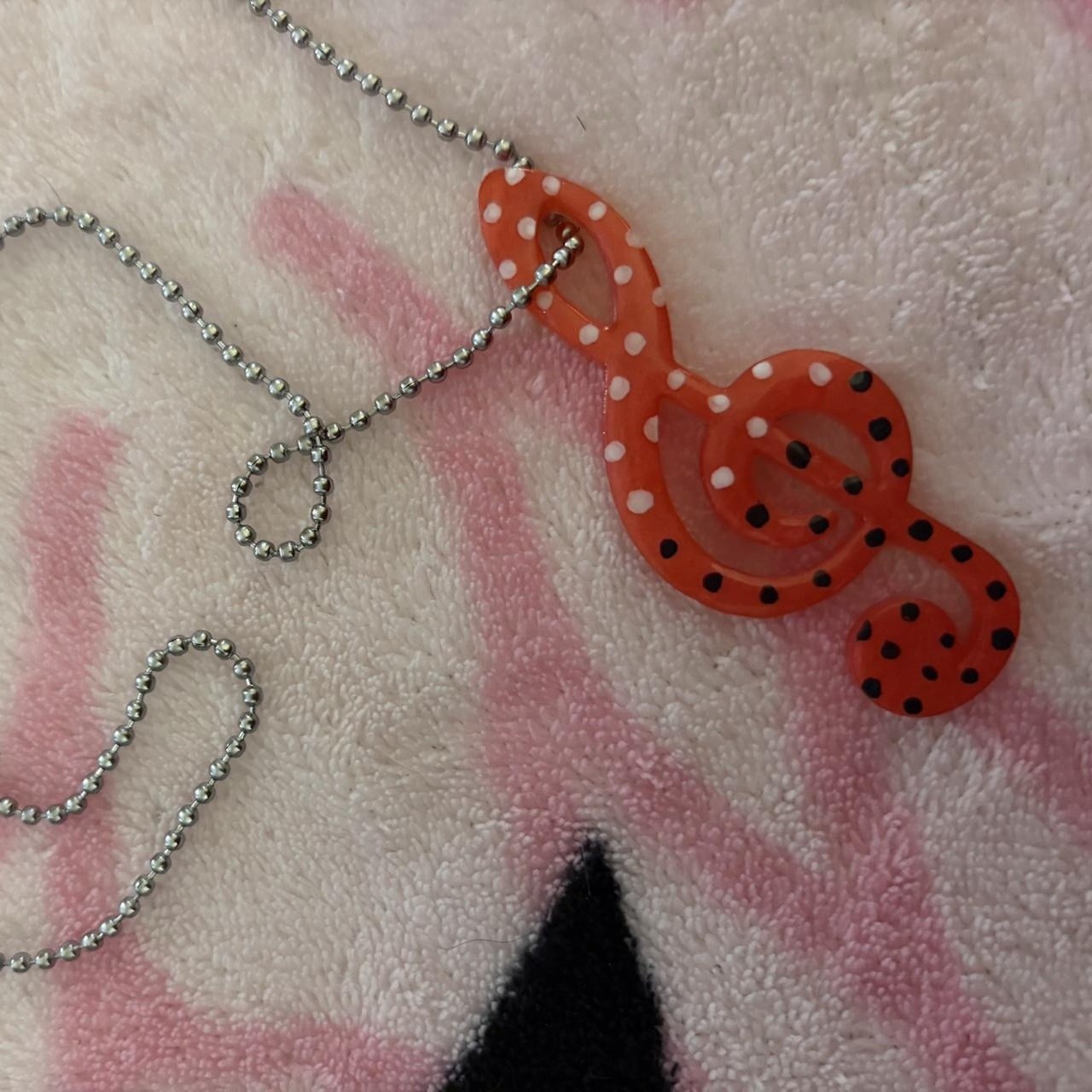 Handmade red treble clef charm necklace with black and white polkadots