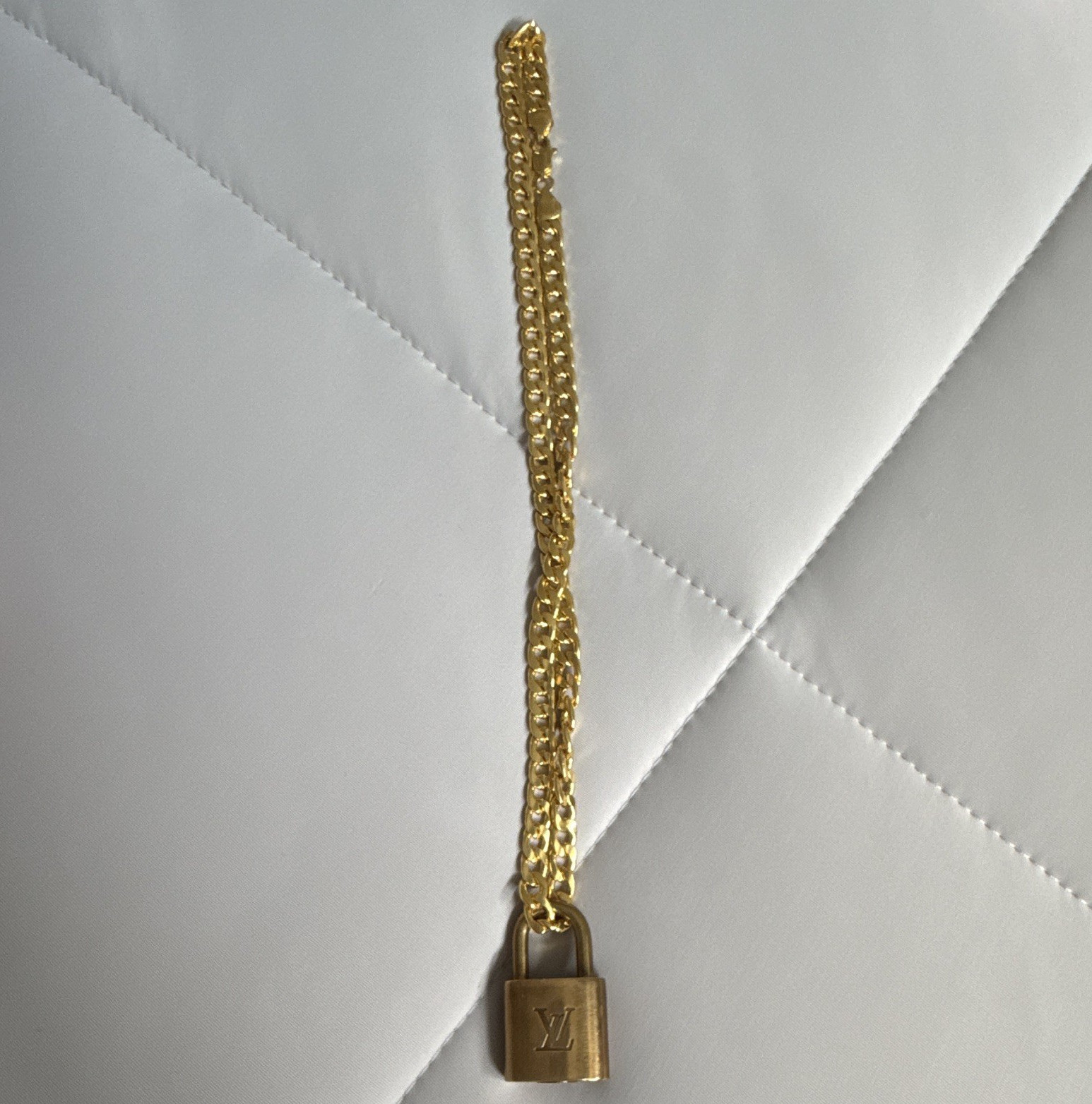 Louis Vuitton Brass Lock (#301) with unbranded chain. (No key).