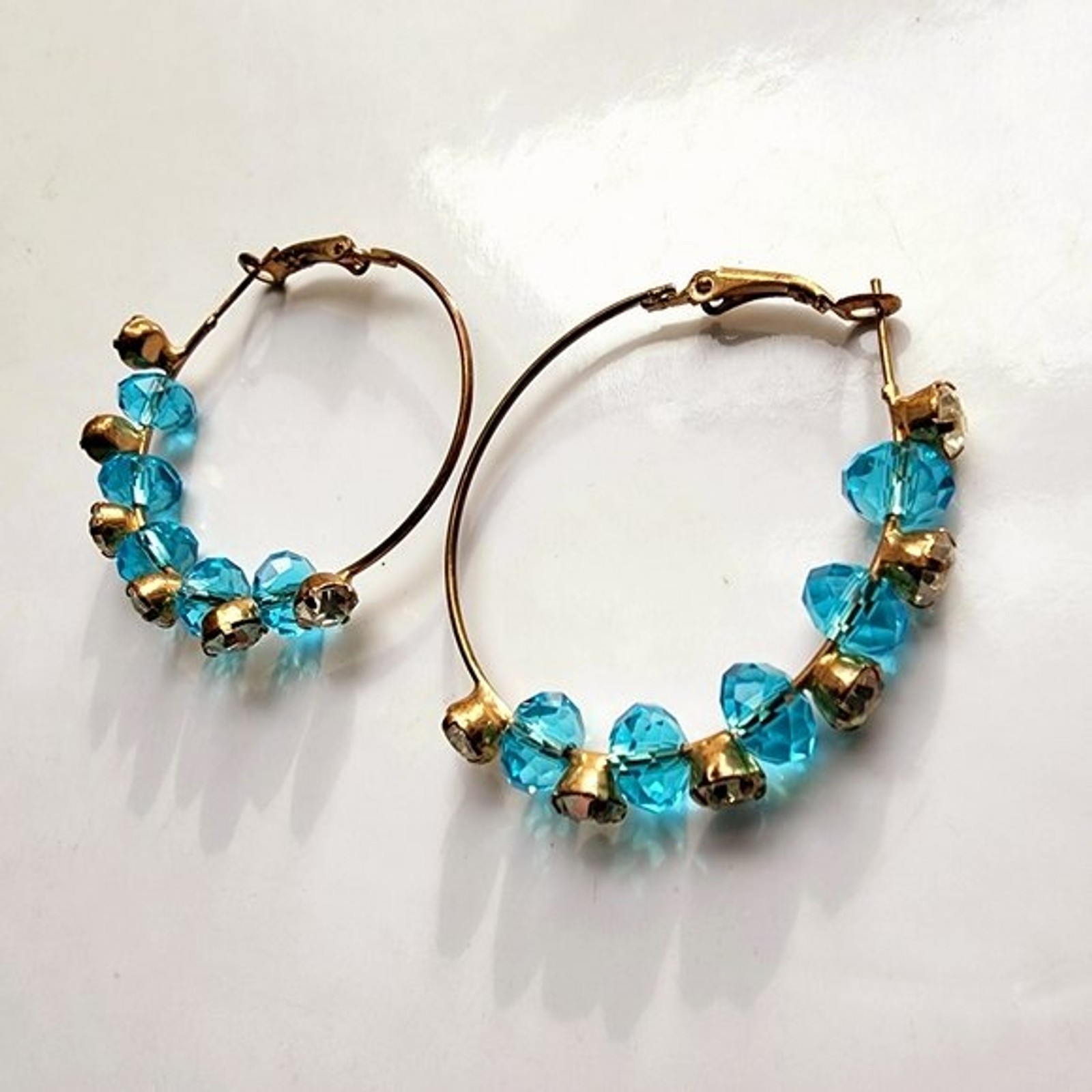 Large Bohemian wire rhinestone station hoops with brilliant blue stones