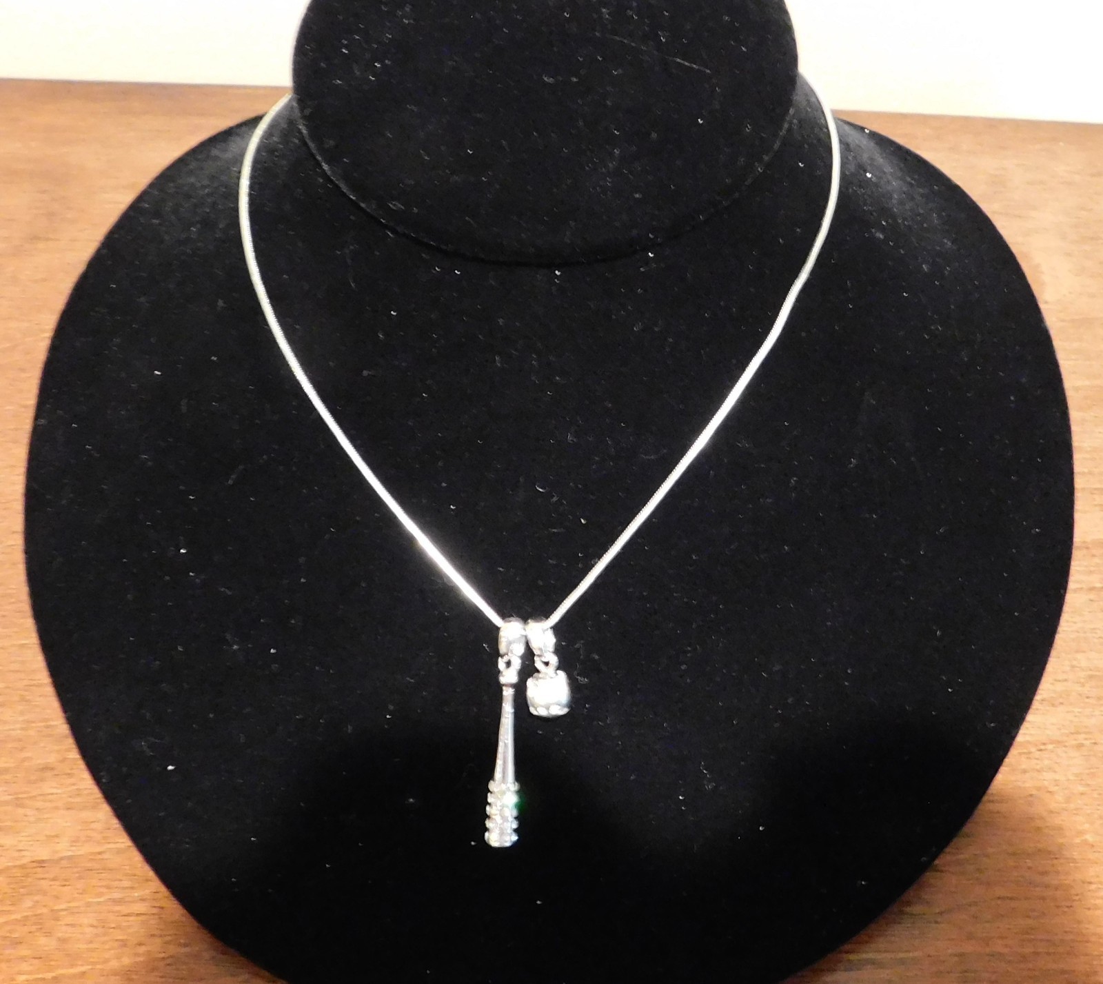 15 inch Necklace in silver tone with rhinesteon baseball bat and ball