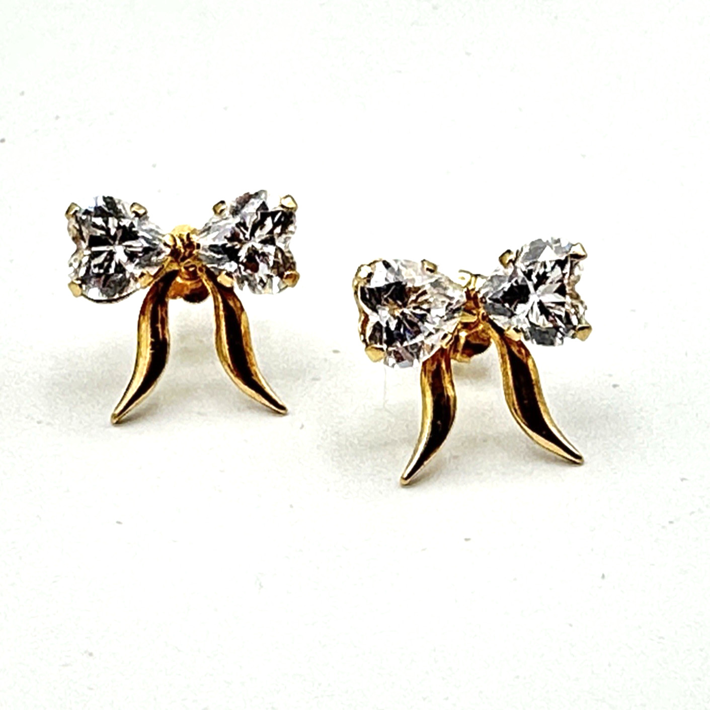 10K ribbon bow earrings – yellow gold studs w/ heart-shape CZs – dainty 3/8″ 1g