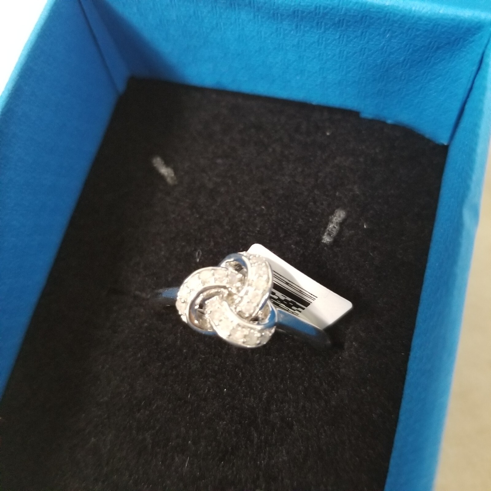 White Diamond Rhodium Over Sterling Silver Knot Ring 0.15ctw