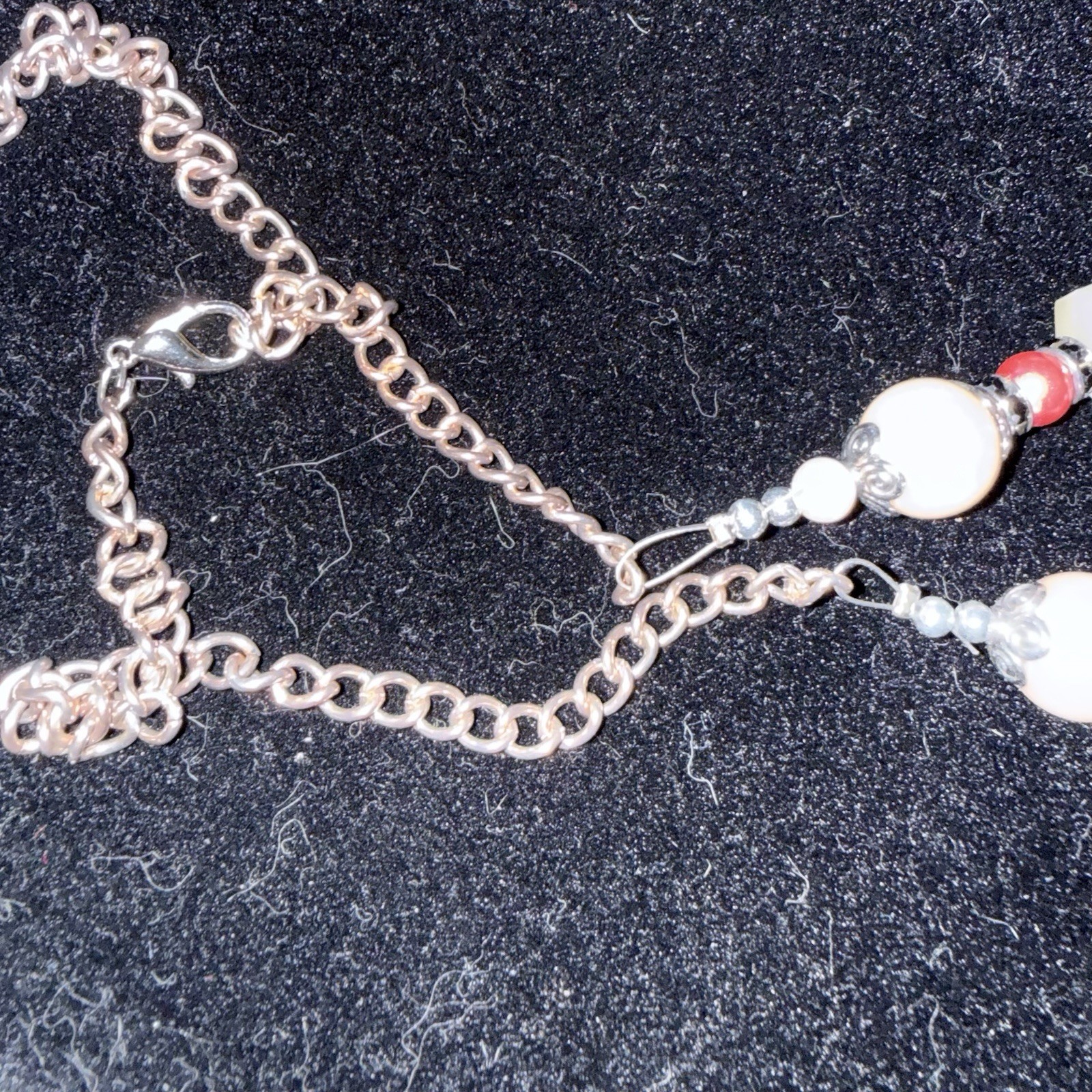 Silver tone red & white beaded necklace w/ orange rectangle charm, adjustable