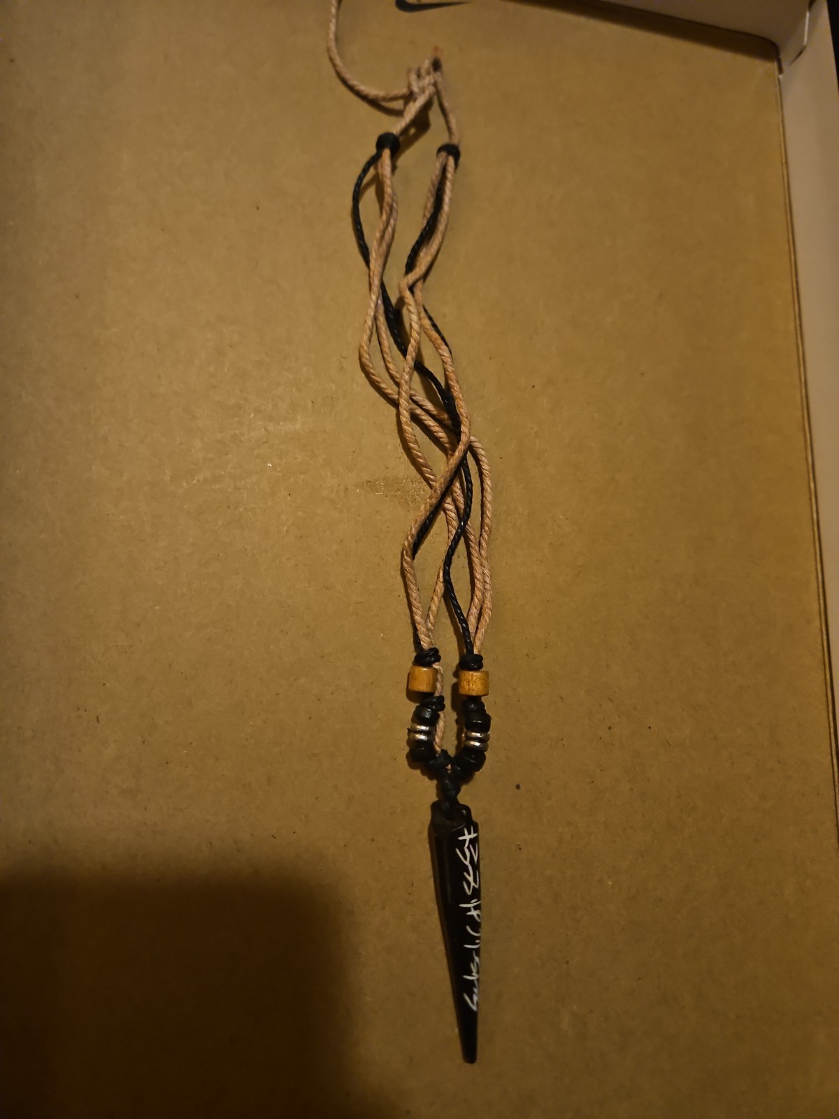 Rope Necklace With Cool Pendant With Unknown Design!