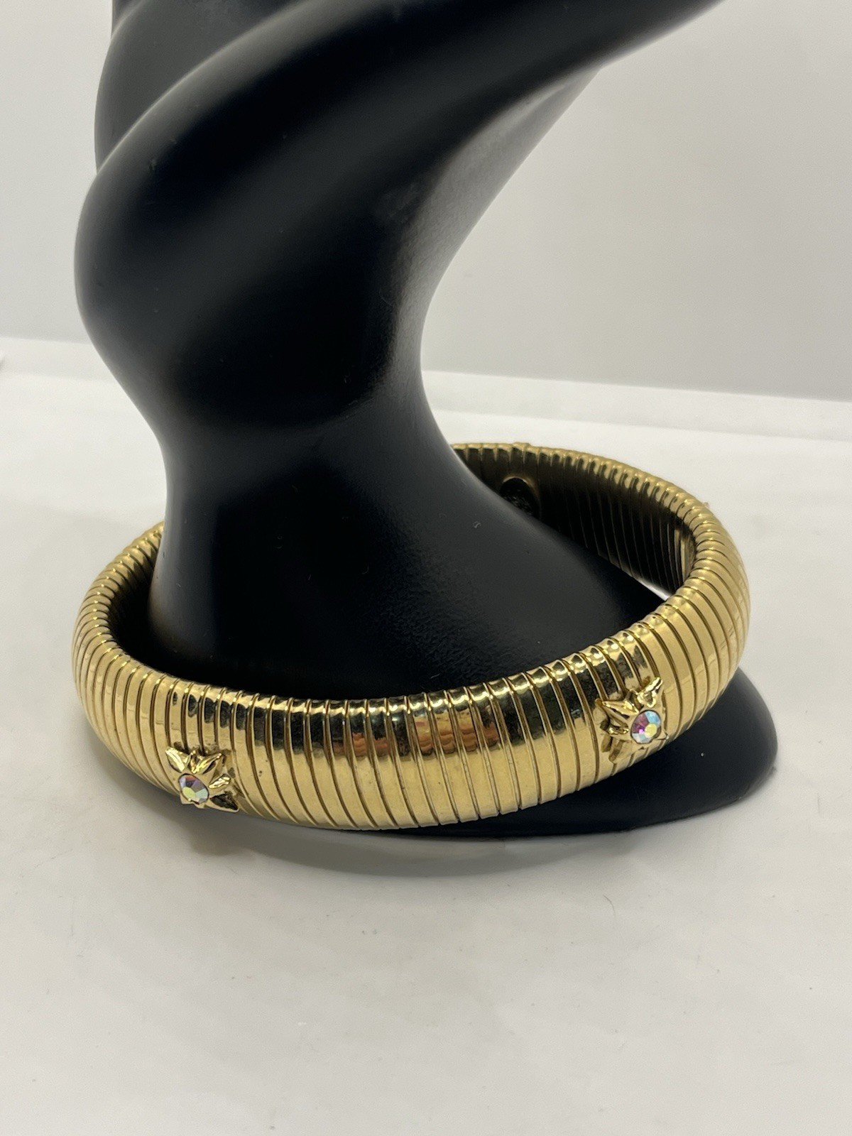 Kirks Folly gold tone tubogas stretch bracelet rhinestone aurora borealis stars