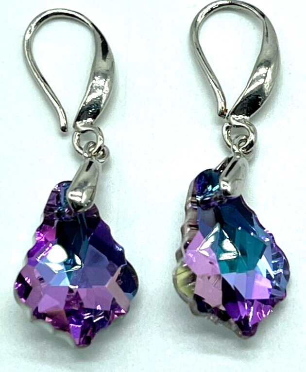 Earrings. Silver Tone with Pinkish Purple Reflective Crystal. Hook. 1″ drop