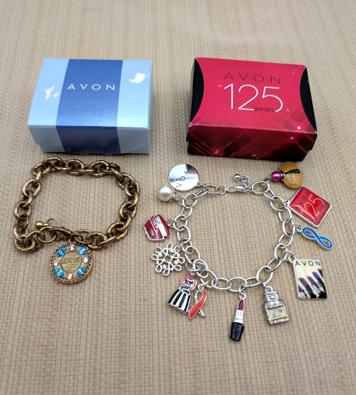 2 Avon Representative Charm Bracelet-125th Anniversary & David H McConnell Award