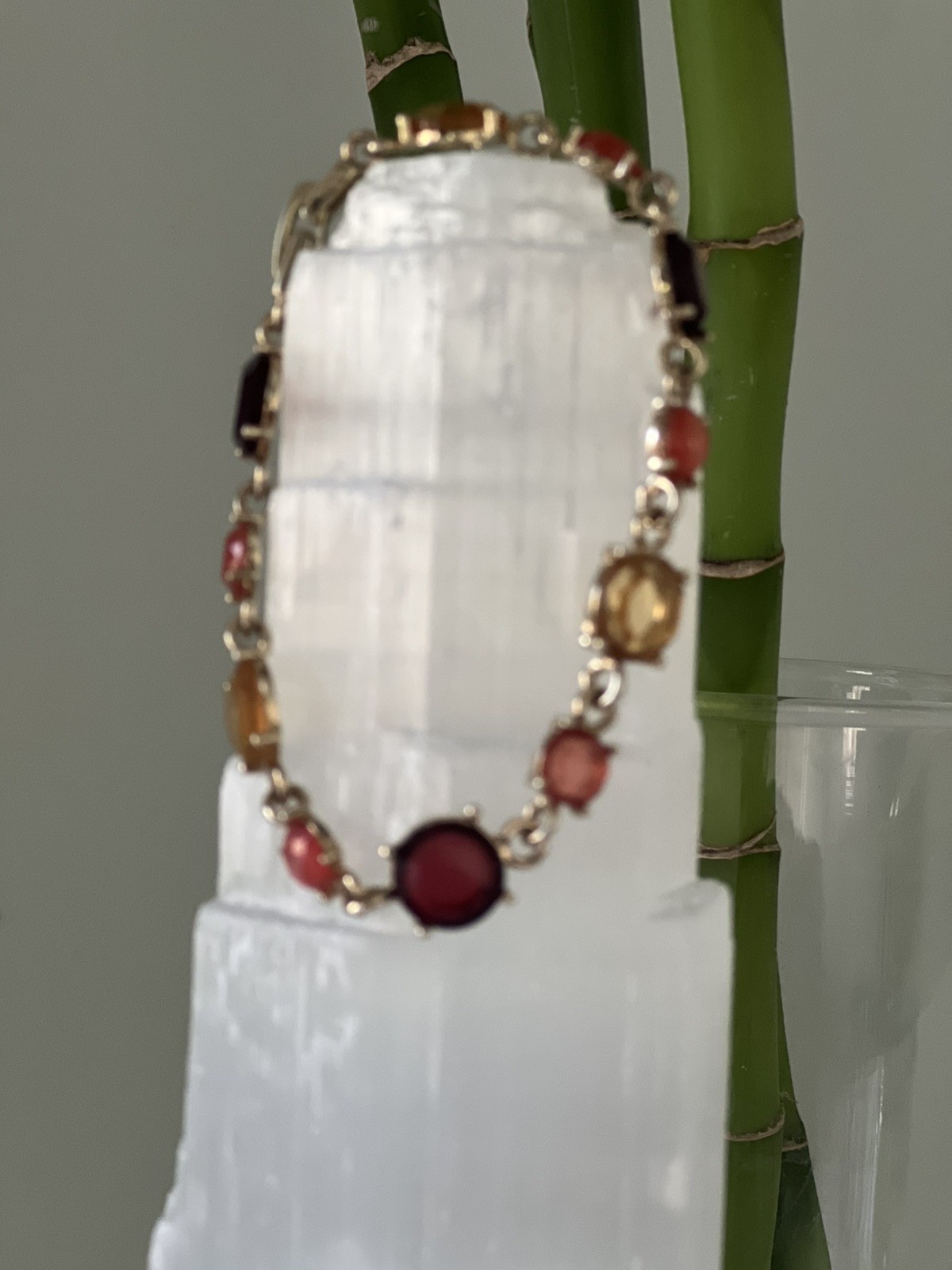UPBEAT earth tones rhinestone bracelet 7 in length/ fold over clasp/ gold tone
