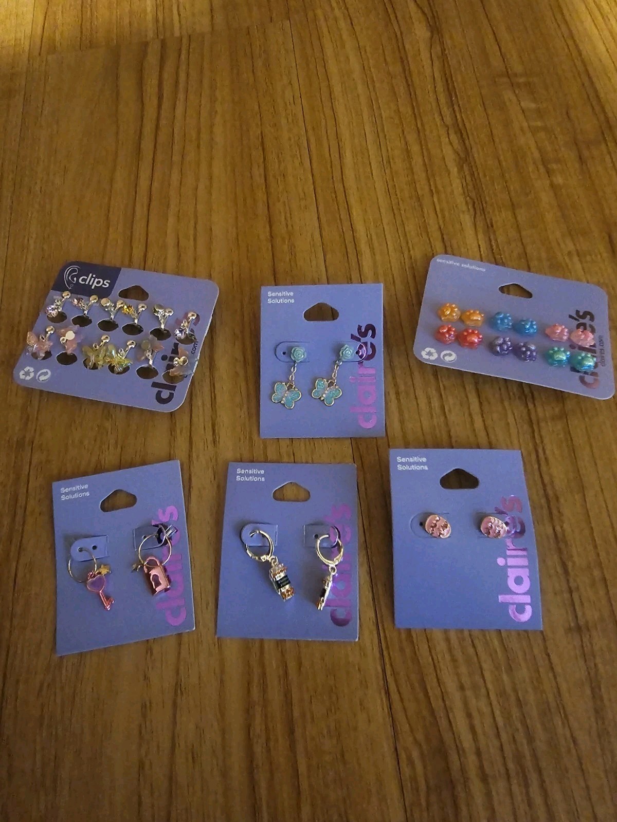 Lot of 6 Sets of Claire’s Earrings Dangle Jewelry Butterflies, Eggs, Paw Prints