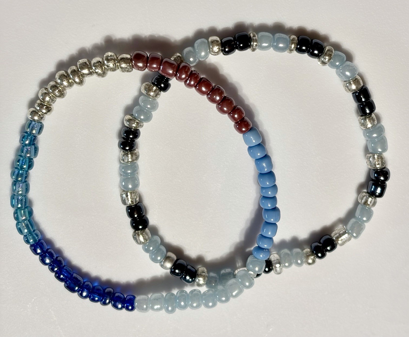 Boho bracelet set,light blue,silver,brown seed beads. Stretchy- 7.25” to 7.75”.
