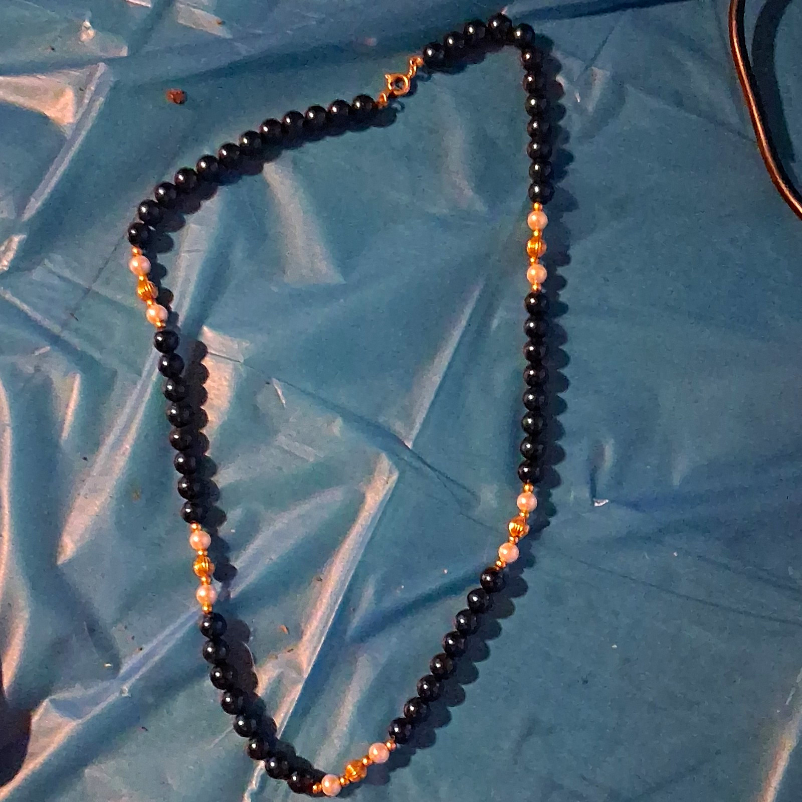Black Beaded Necklace with Gold Tone Bead Accents, Spring Ring Clasp