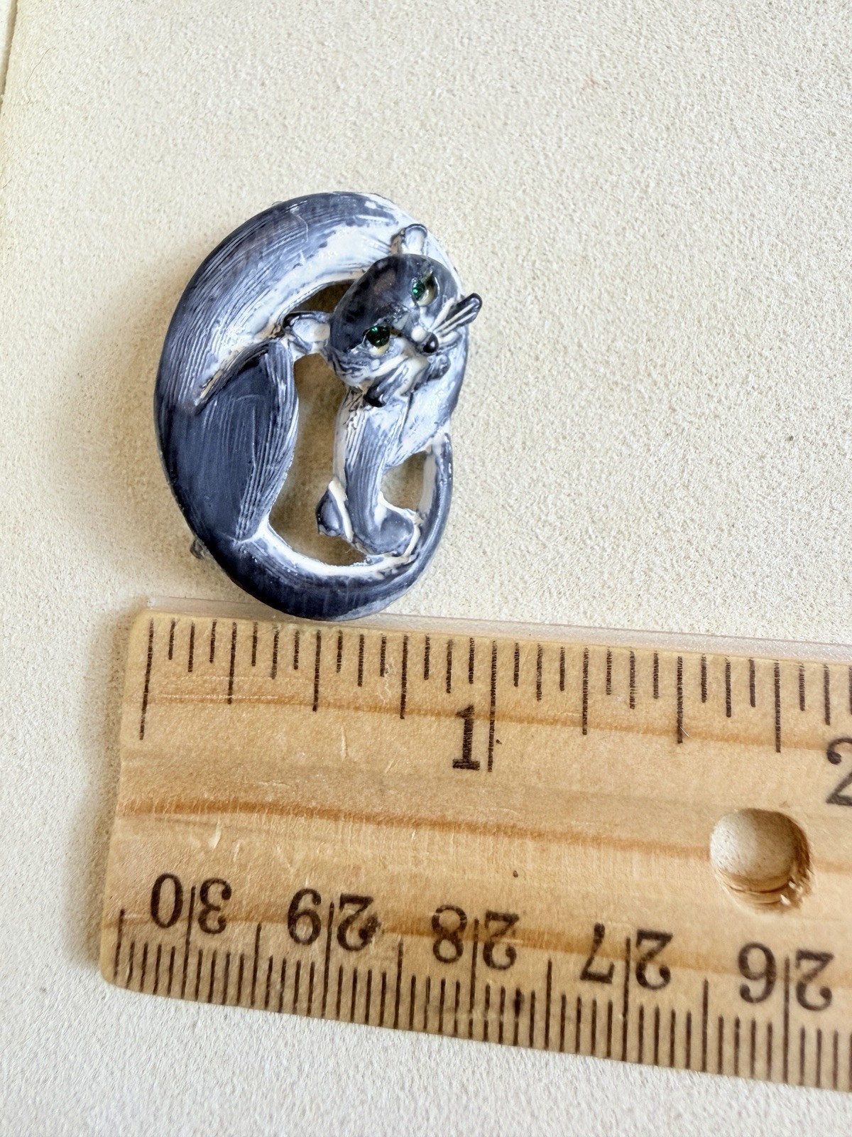 Vintage brooch clay sleeping cat with a brushed black and white finish