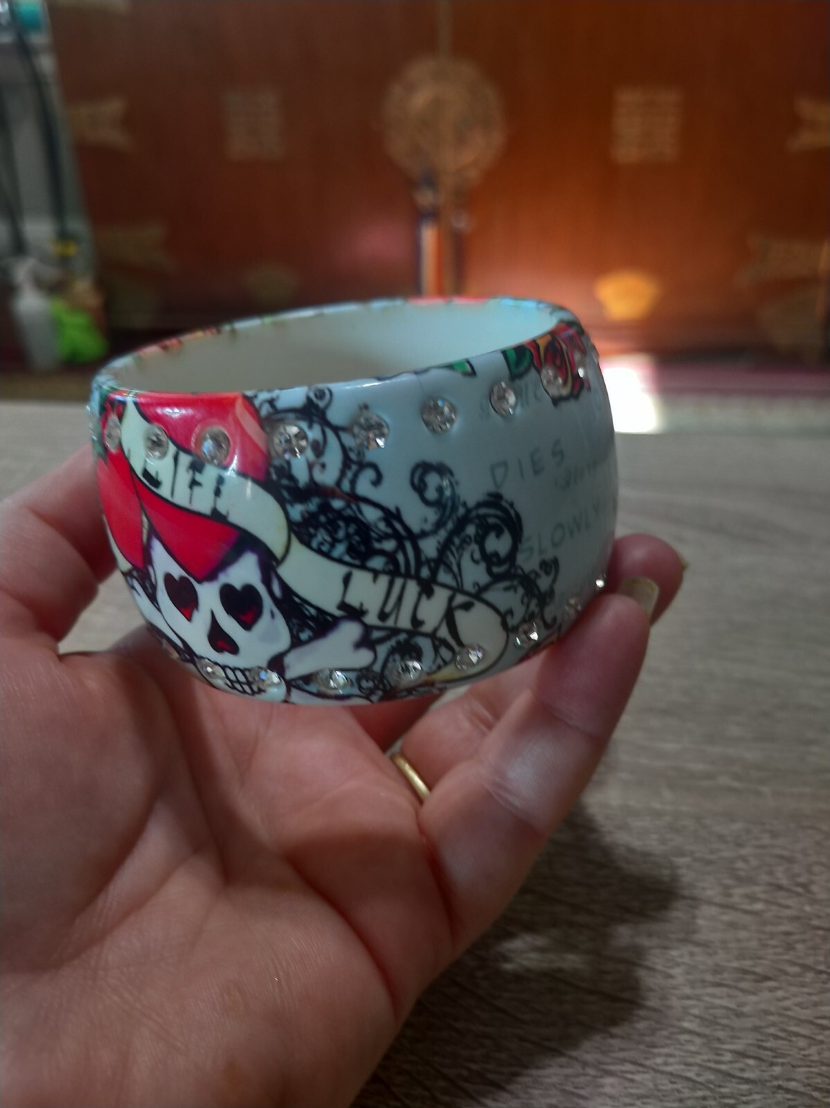 Plastic, rhinestone bangle bracelet. Love life luck skeleton skull tattoo