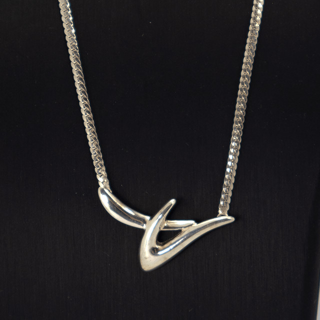 Abstract silver necklace with modern sculptural design