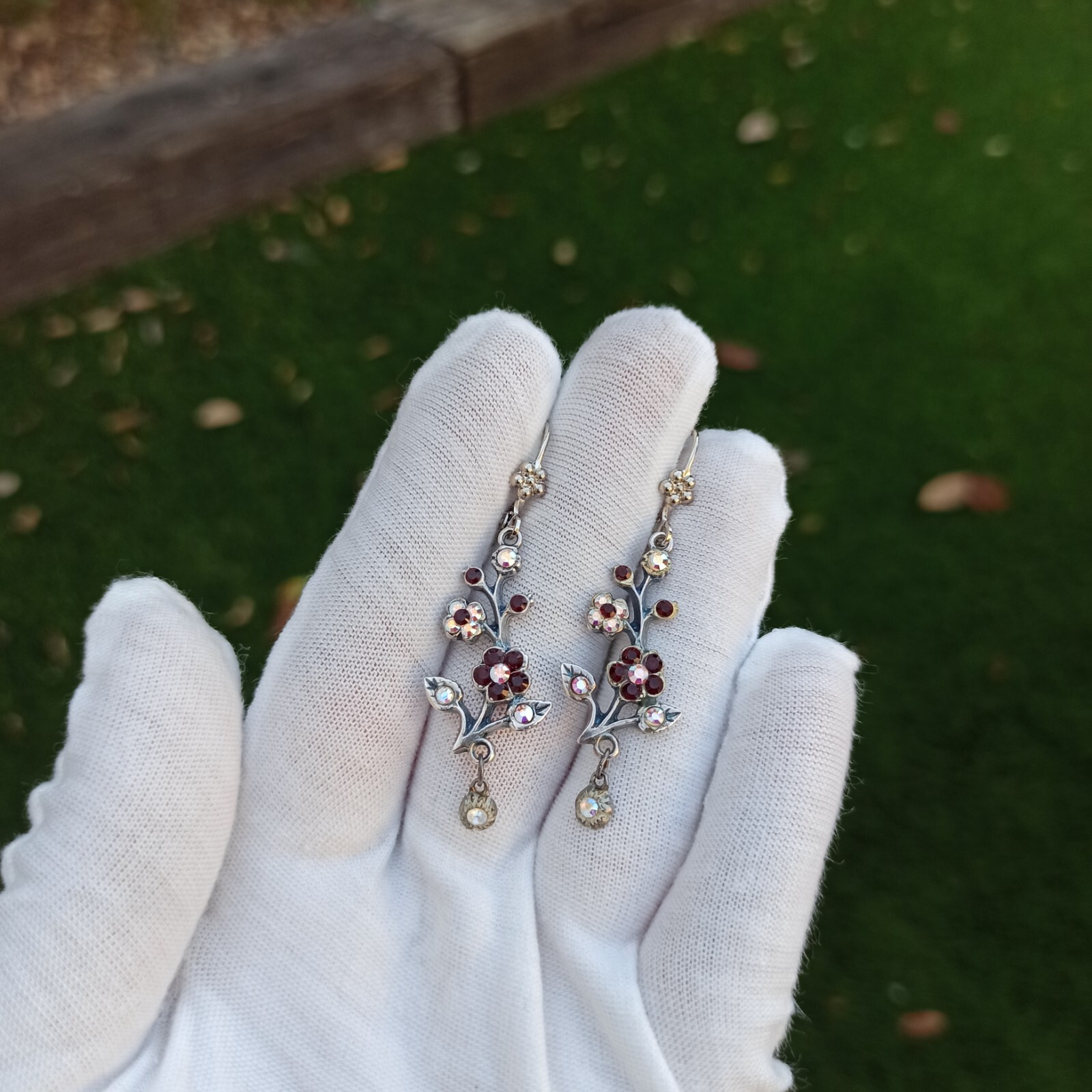 Michal Negrin Earrings Silver Aurora Borealis Red Crystals Long Flower Branch