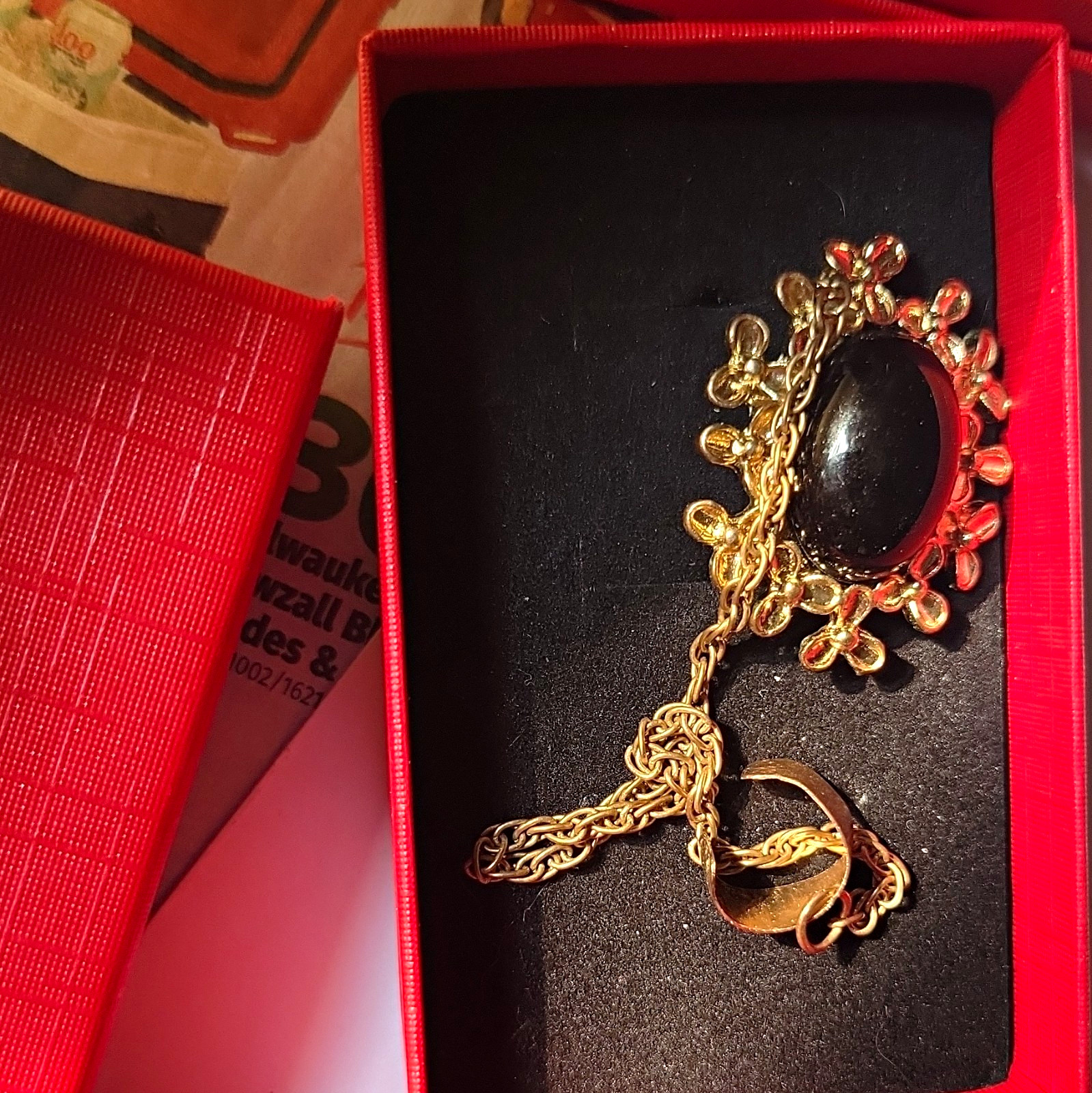 This is a single post yeĺlow gold black onyx slave earring with post attached cl