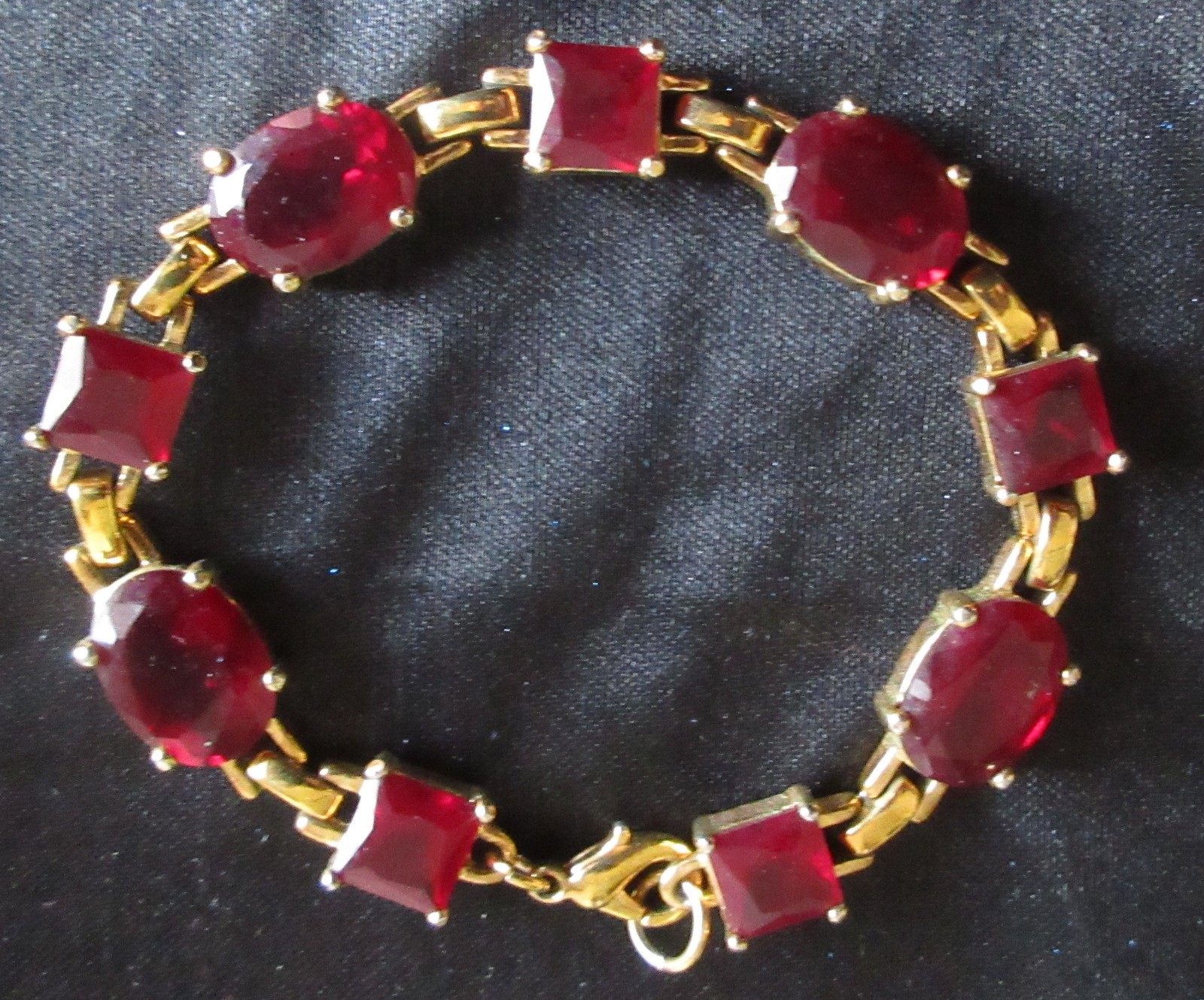Bracelet Red Faceted Square and Oval Stones Open in Back Lobster Claw Closure