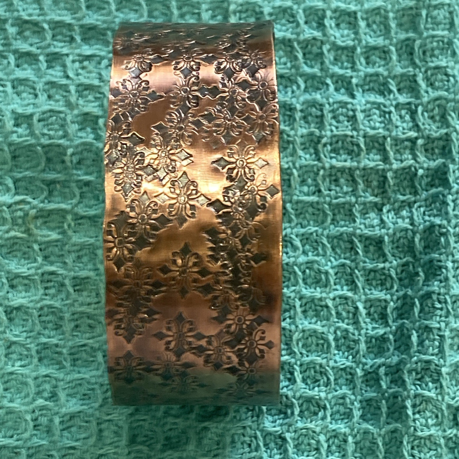 Wide floral embossed copper open-ended cuff bracelet, size 6.5 in, no stone