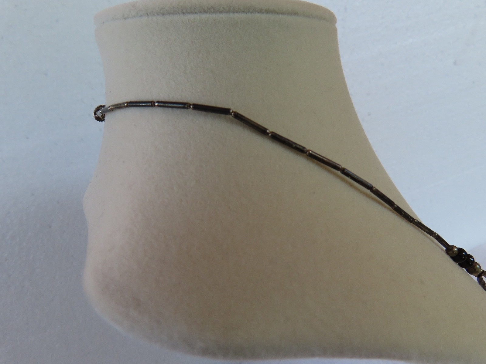 Black Beaded necklace, measures 18″ about.