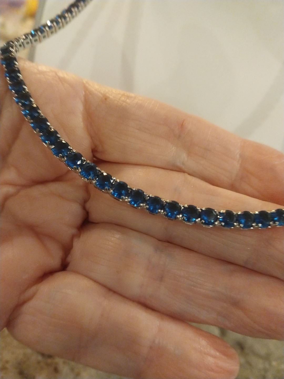 Simulated Sapphire Tennis Necklace (18-26 Inches) with Bolo Slider in Silvertone