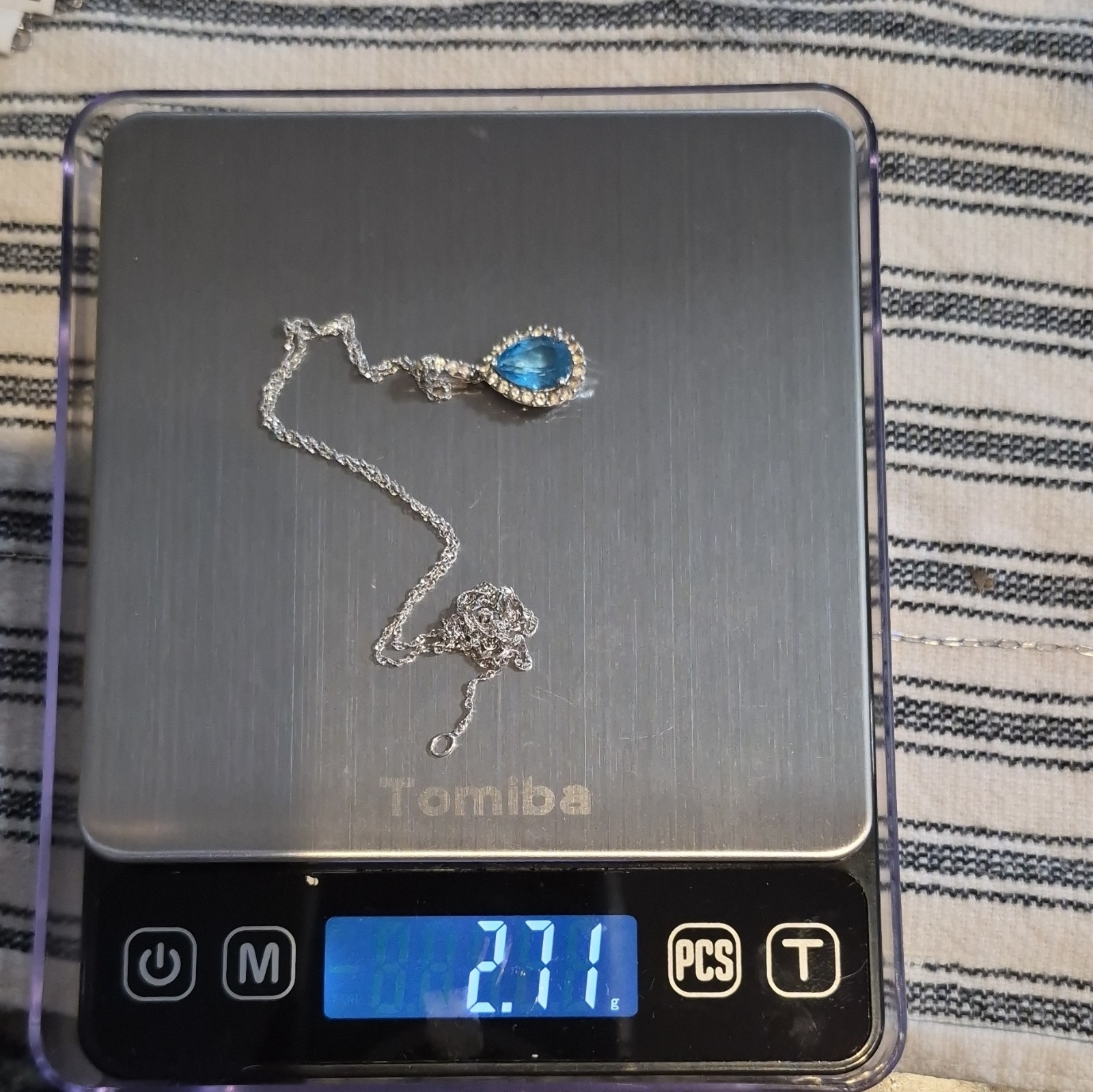 14kt white gold blue topaz and diamond accented necklace 18 inch chain