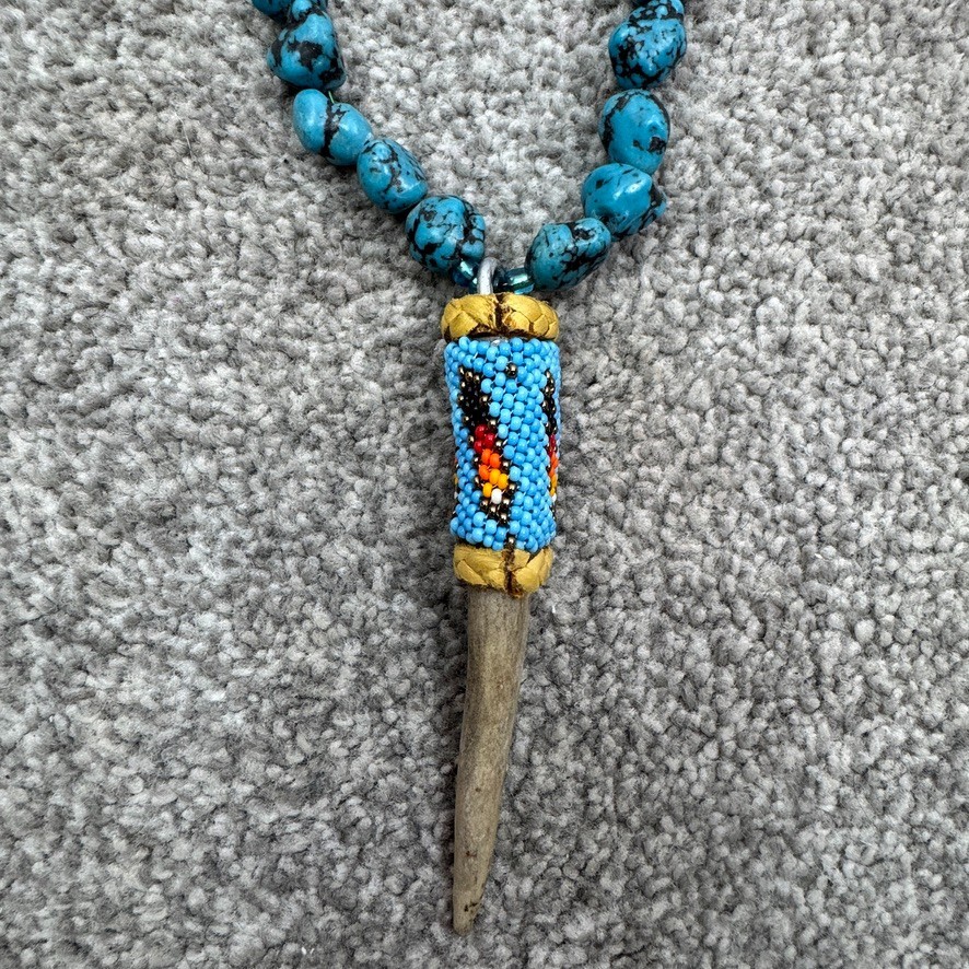 Handmade Necklace With Bone Pendant Wrapped In Beading On Blue Speckled Stones
