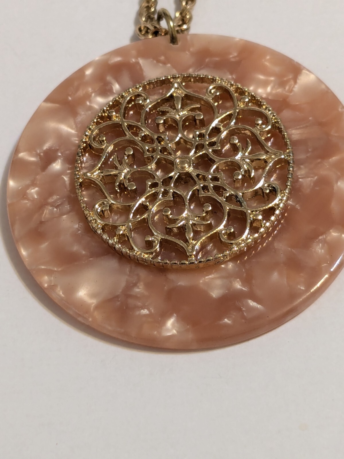 Peach Faux Shell Medallion Pendant Gold Tone Necklace. Metal Scroll Work. 30″.