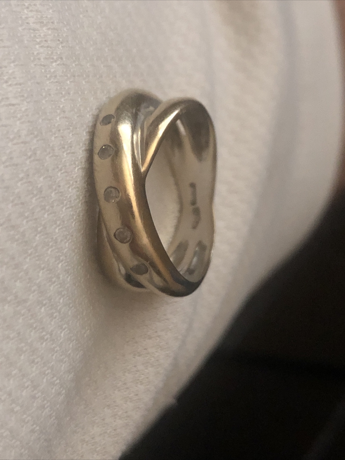 ALL SILVER RING, NOT SURE OF SIZE, CONFIRMED BY A JEWLERY STORE
