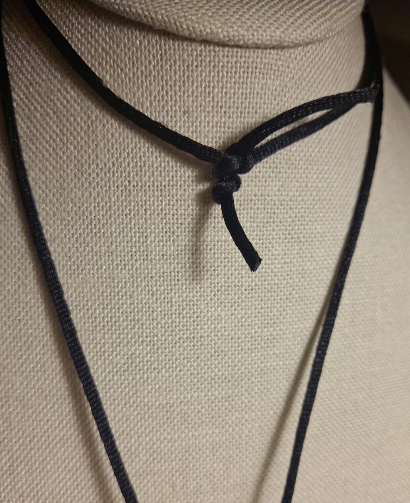 No brand glass or acrylic faceted clear ball w/black knotted cord necklace