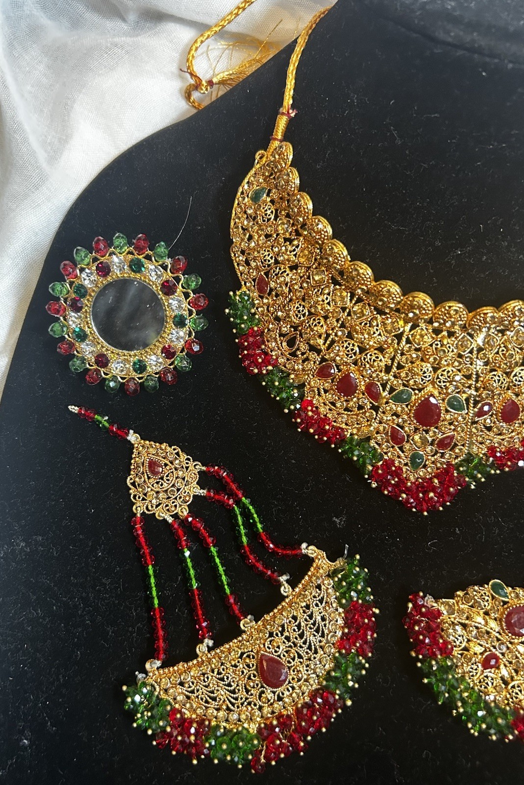 Gold Jewelry Set with Red and Green Details