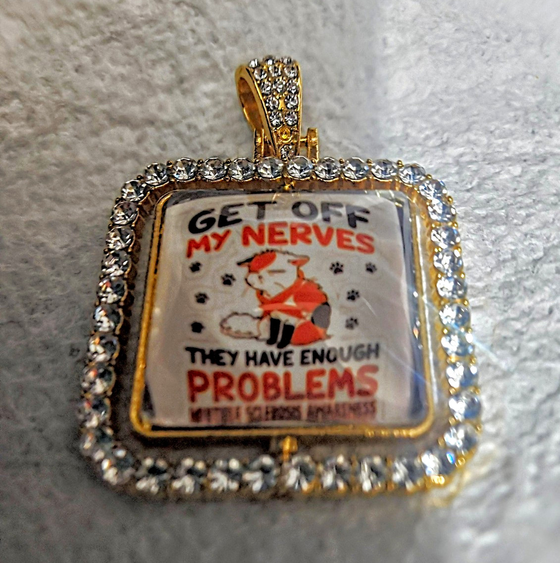 Square White Crystal Pavé Border Charm Pendant, Awareness, “GET OFF MY NERVES”