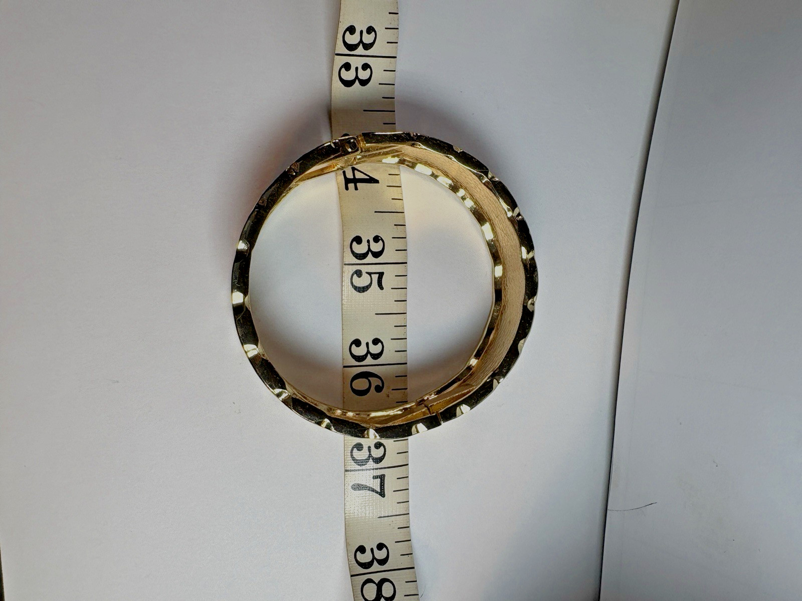 Bold and modern hinged cuff bracelet ,gold-tone with black enamel