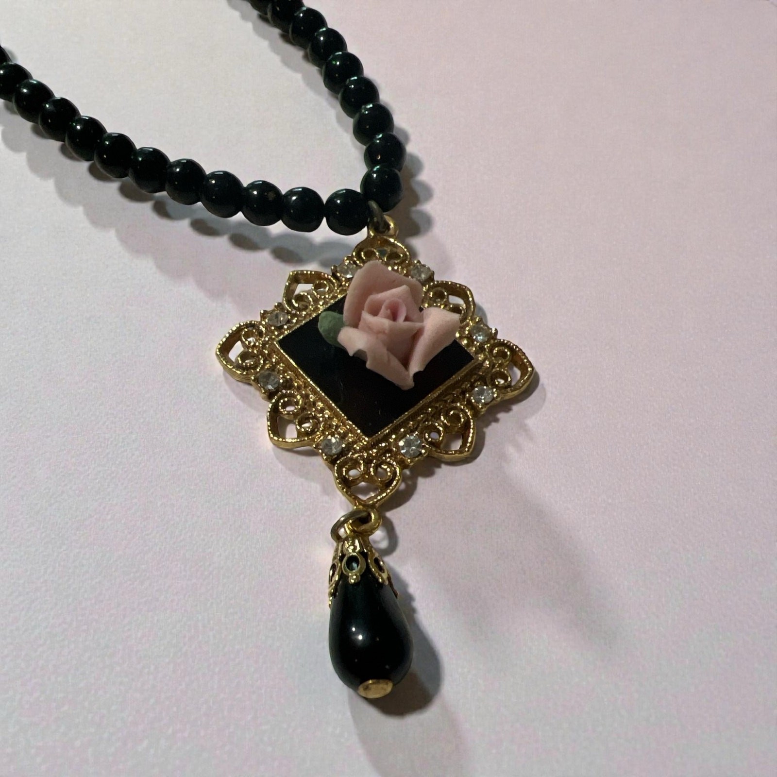 Vintage 1928 Jewelry Co with Black Beads and Gold-tone Pendant w/Pink Rose