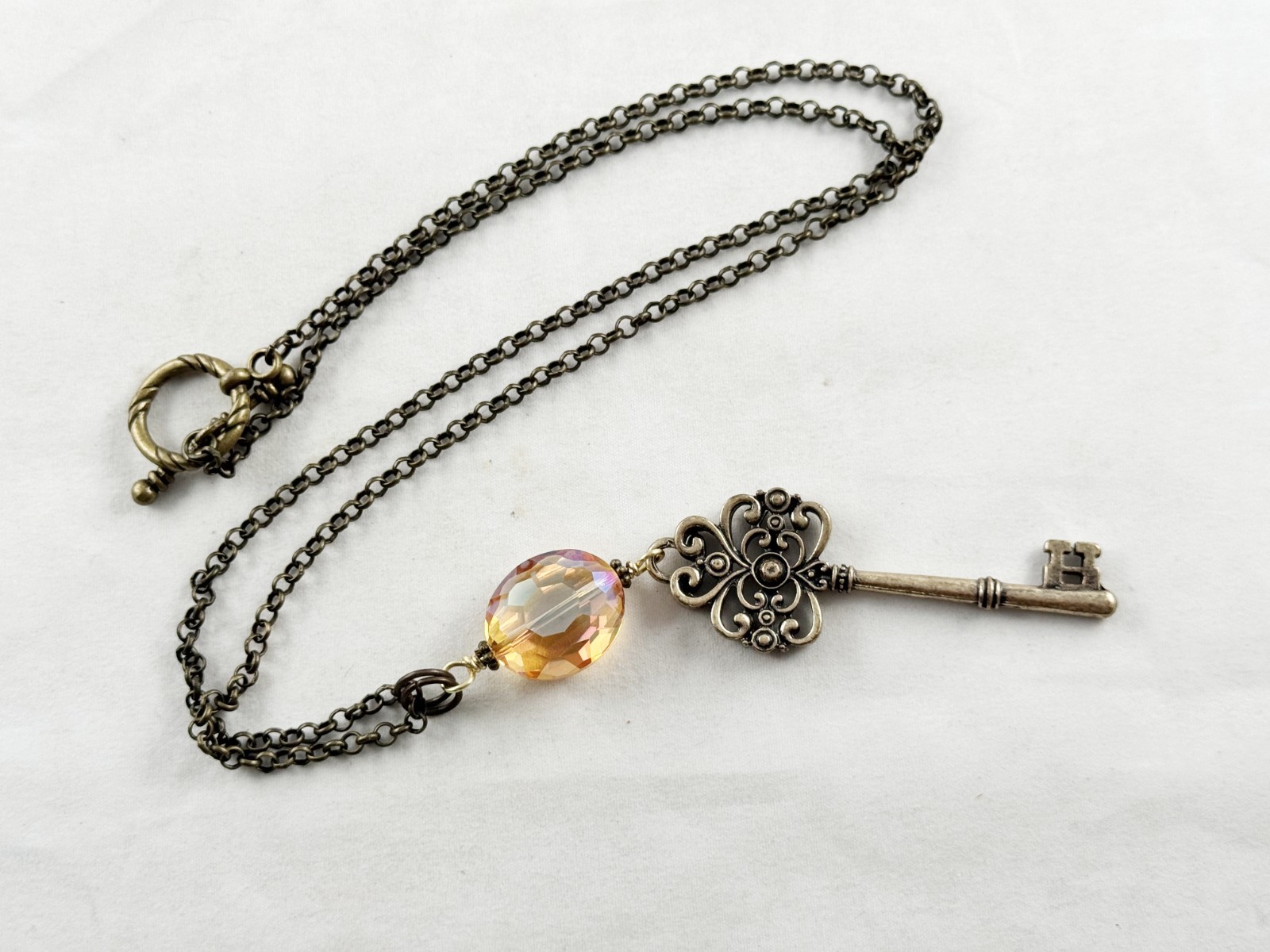 Antique bronze color chain necklace with Amber crystal and ornate key