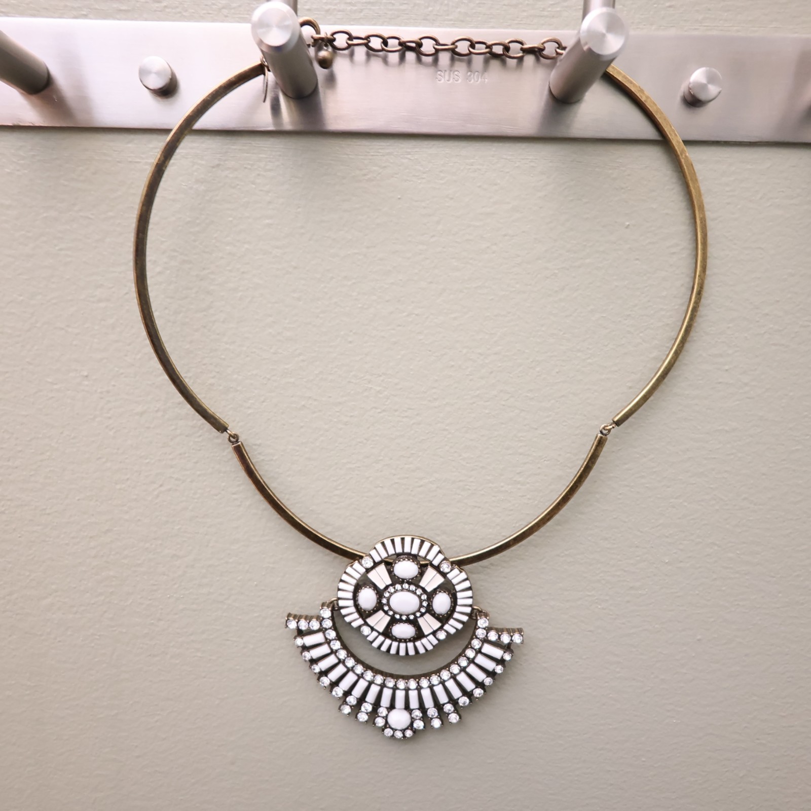 Logo Links necklace Lori Goldstein ivory crystals statement collar bronzetone