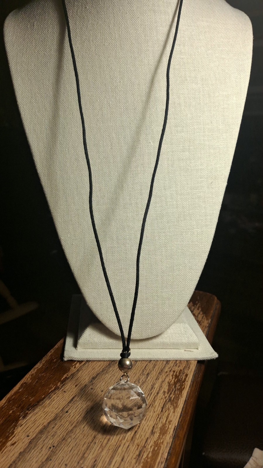 No brand glass or acrylic faceted clear ball w/black knotted cord necklace